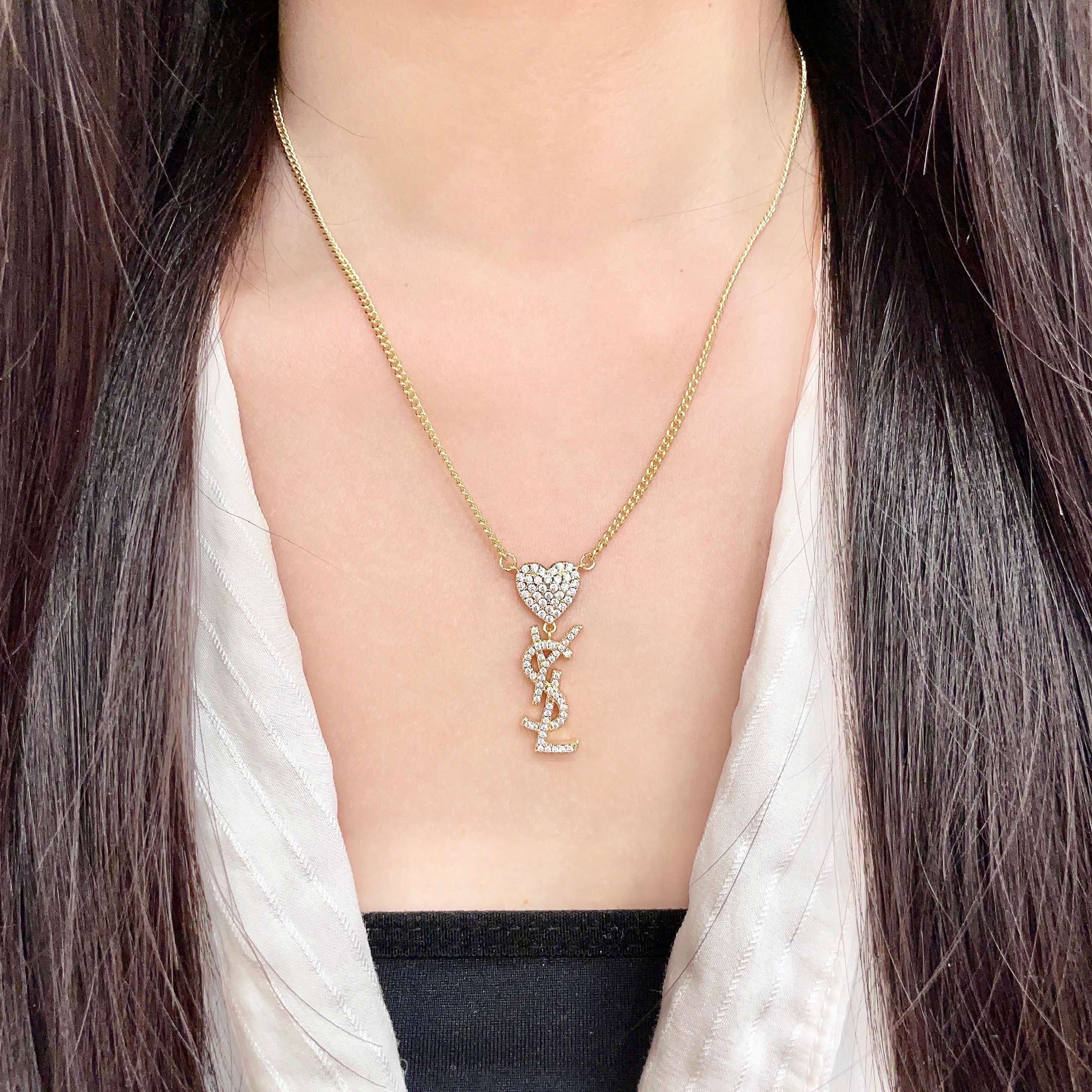 Saint Laurent 1961 Heart Monogram Pendant necklace Gold-tone metal with clear pave crystals 45cm