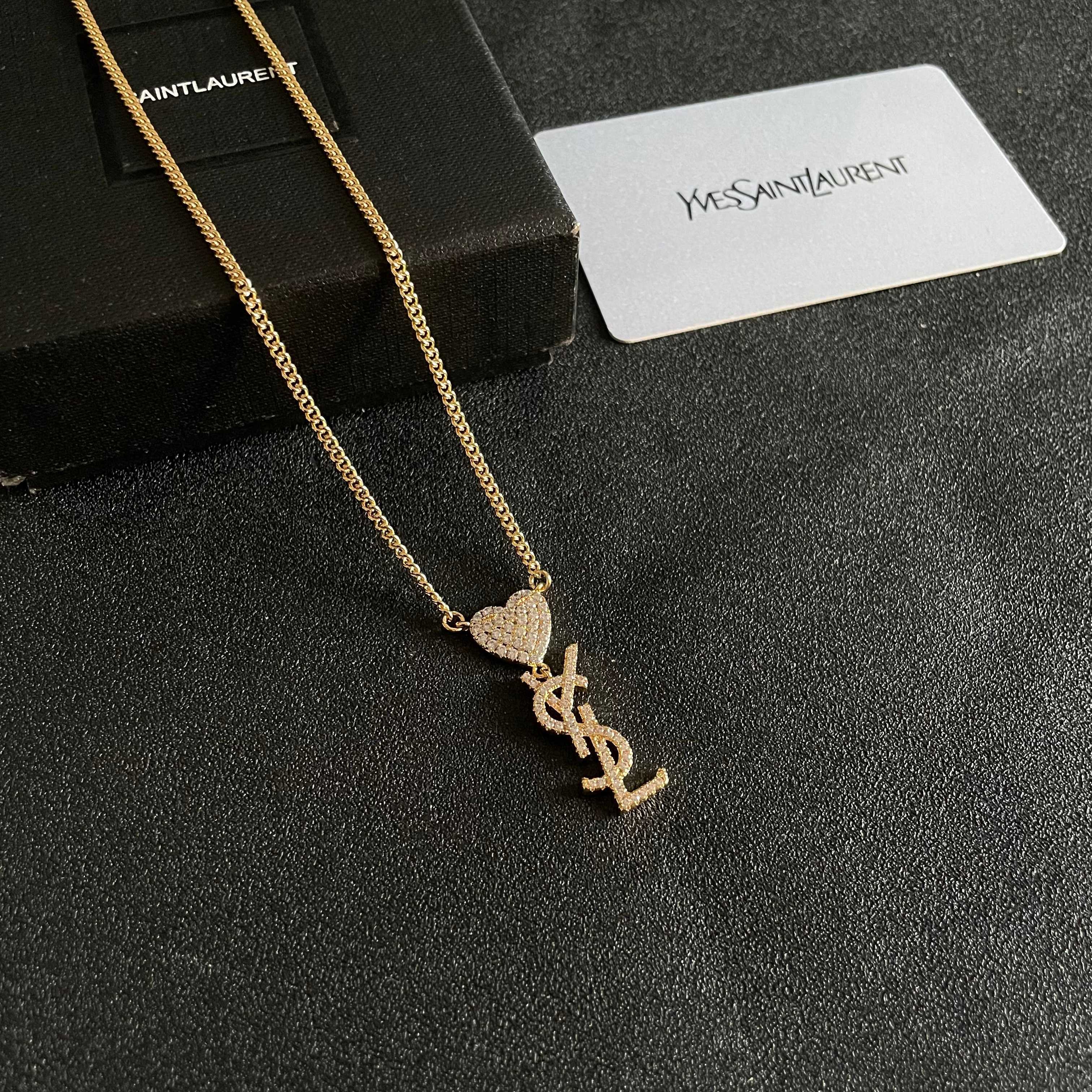 Saint Laurent 1961 Heart Monogram Pendant necklace Gold-tone metal with clear pave crystals 45cm