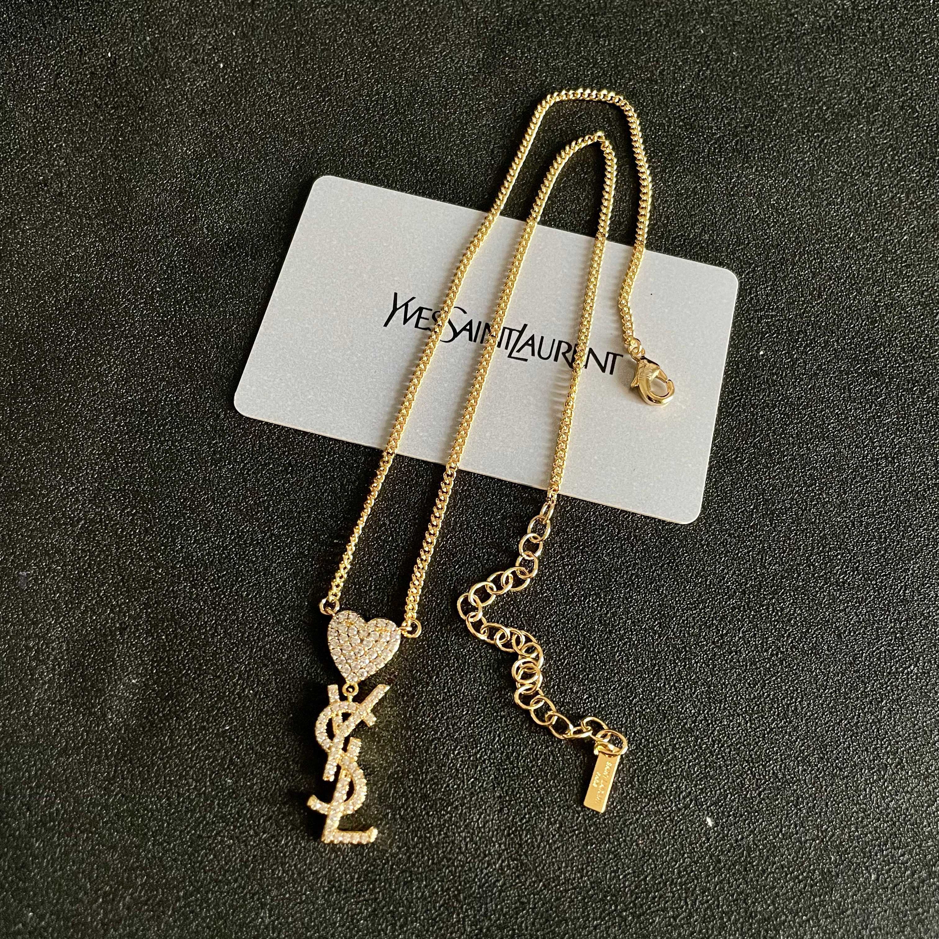 Saint Laurent 1961 Heart Monogram Pendant necklace Gold-tone metal with clear pave crystals 45cm