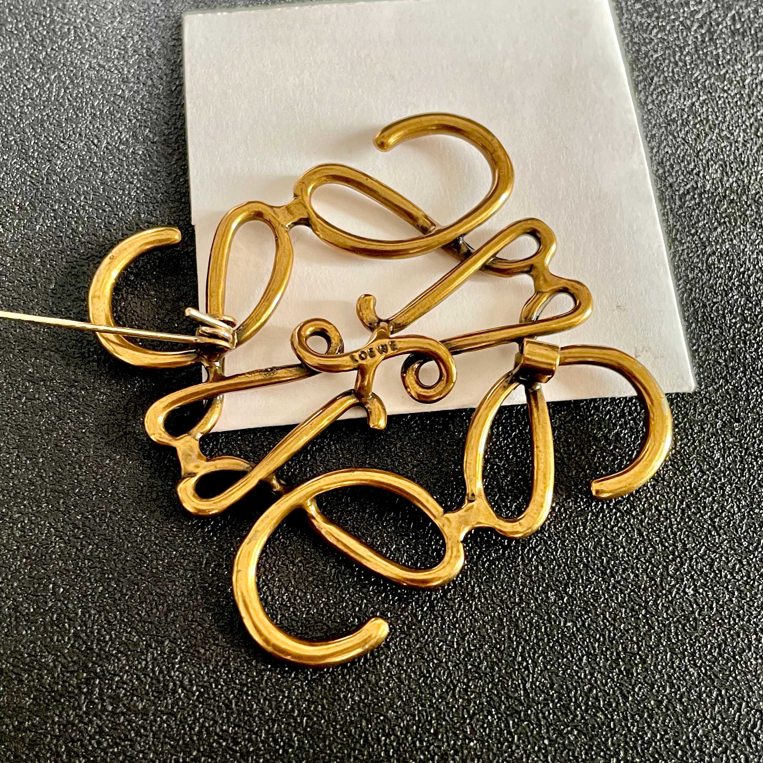 Loewe Anagram brooch antique gold metal 4 5cm width