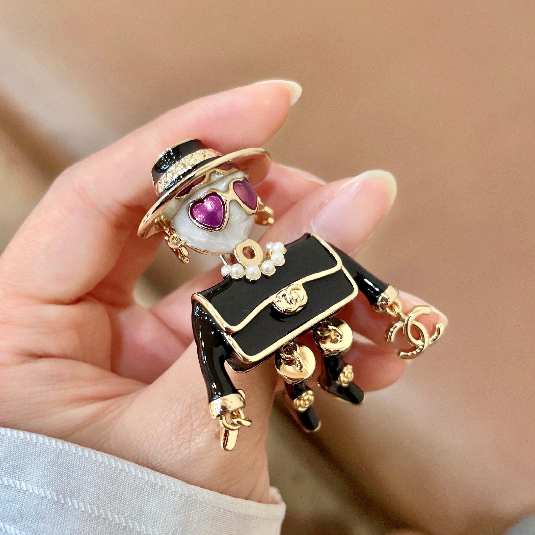 Chanel CC Logo Doll Robot Brooch brooch gold tone metal black enamel white faux pearl purple heart enamel white resin 4 5cm height