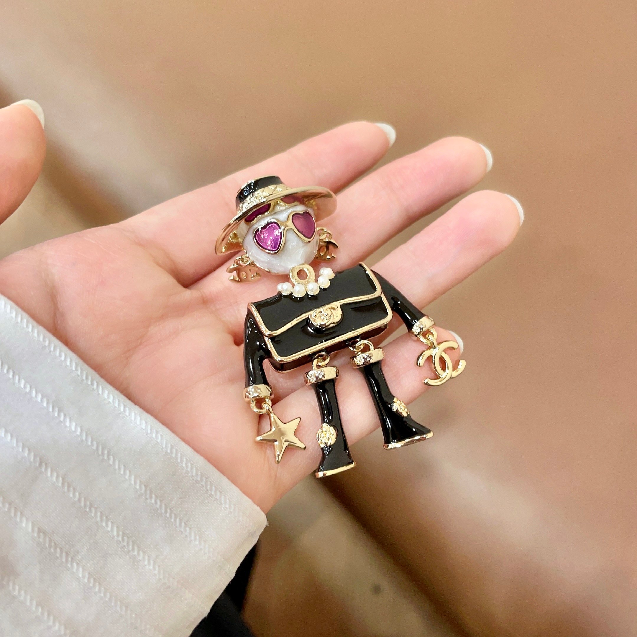 Chanel CC Logo Doll Robot Brooch brooch gold tone metal black enamel white faux pearl purple heart enamel white resin 4 5cm height