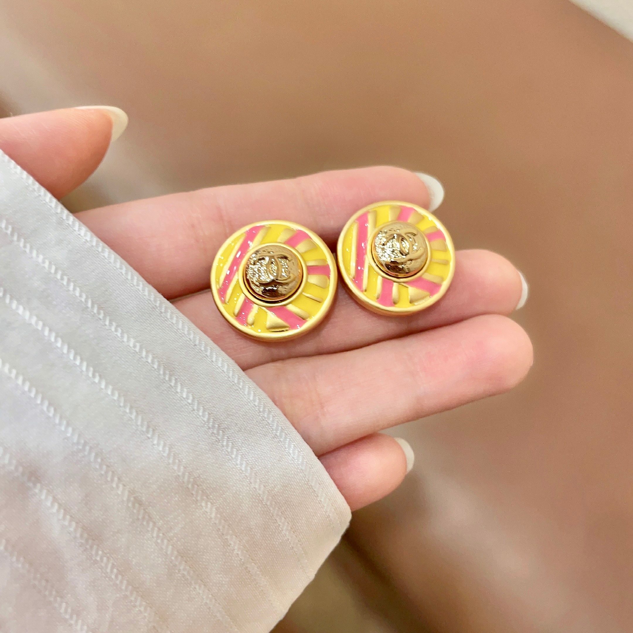 Chanel CC Logo Candy Stripe Button Stud Earrings earrings Gold-tone metal with yellow and pink enamel 1 8cm diameter