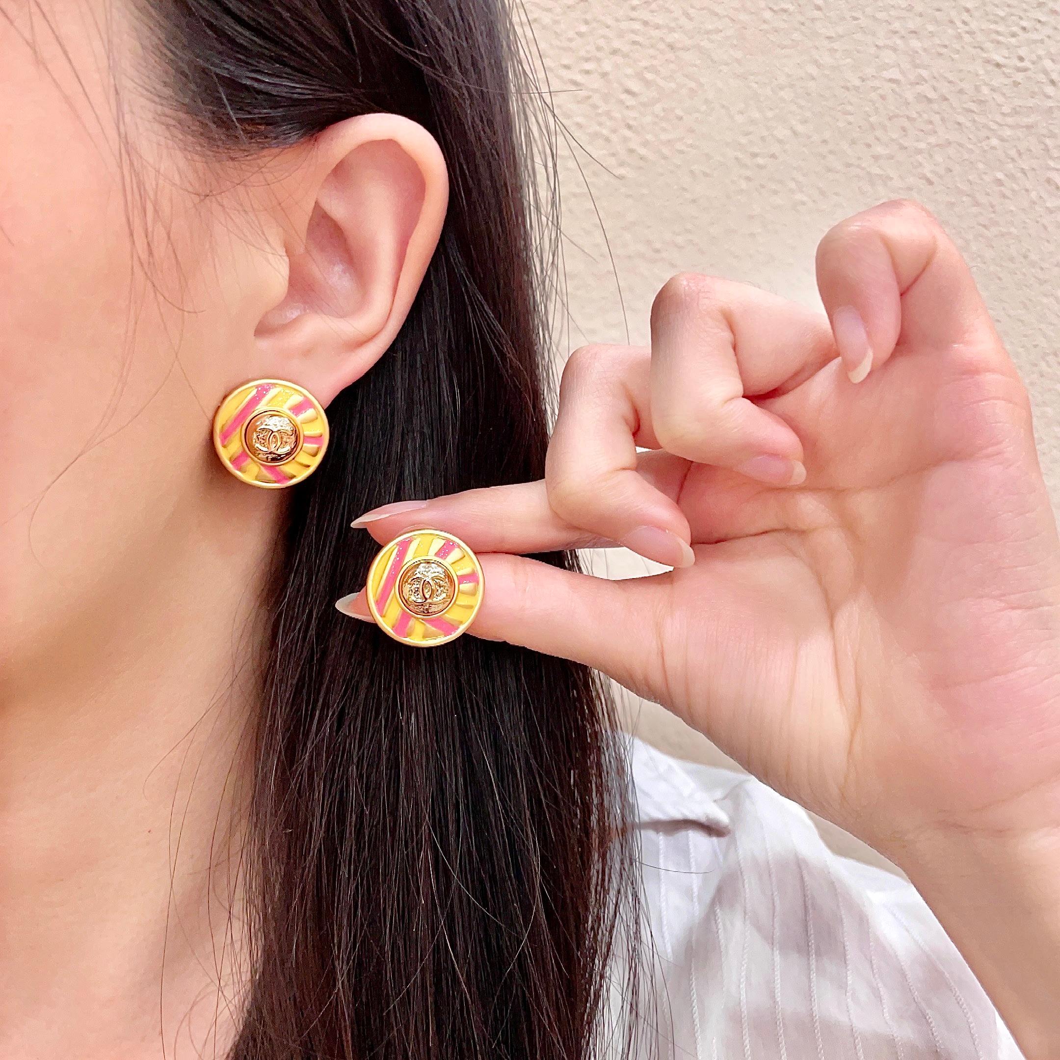 Chanel CC Logo Candy Stripe Button Stud Earrings earrings Gold-tone metal with yellow and pink enamel 1 8cm diameter
