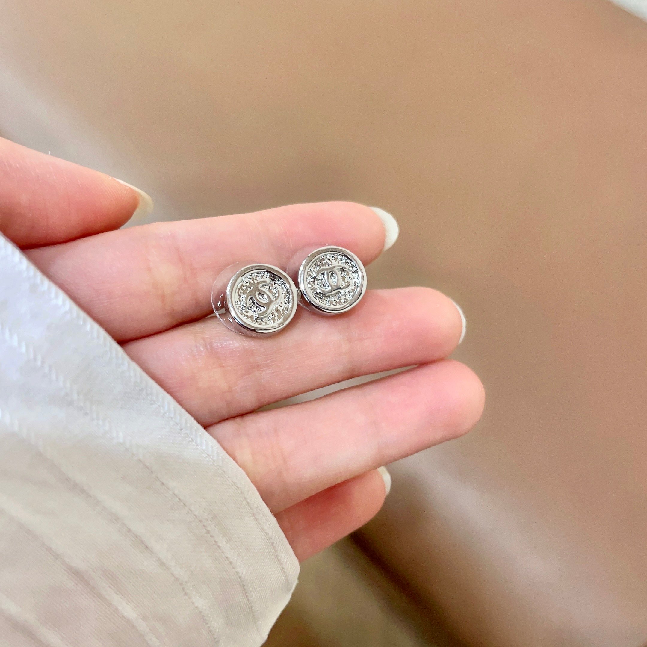 Chanel CC Logo Round Button Stud Earrings earrings silver-tone metal with clear crystal accents 1 2cm diameter