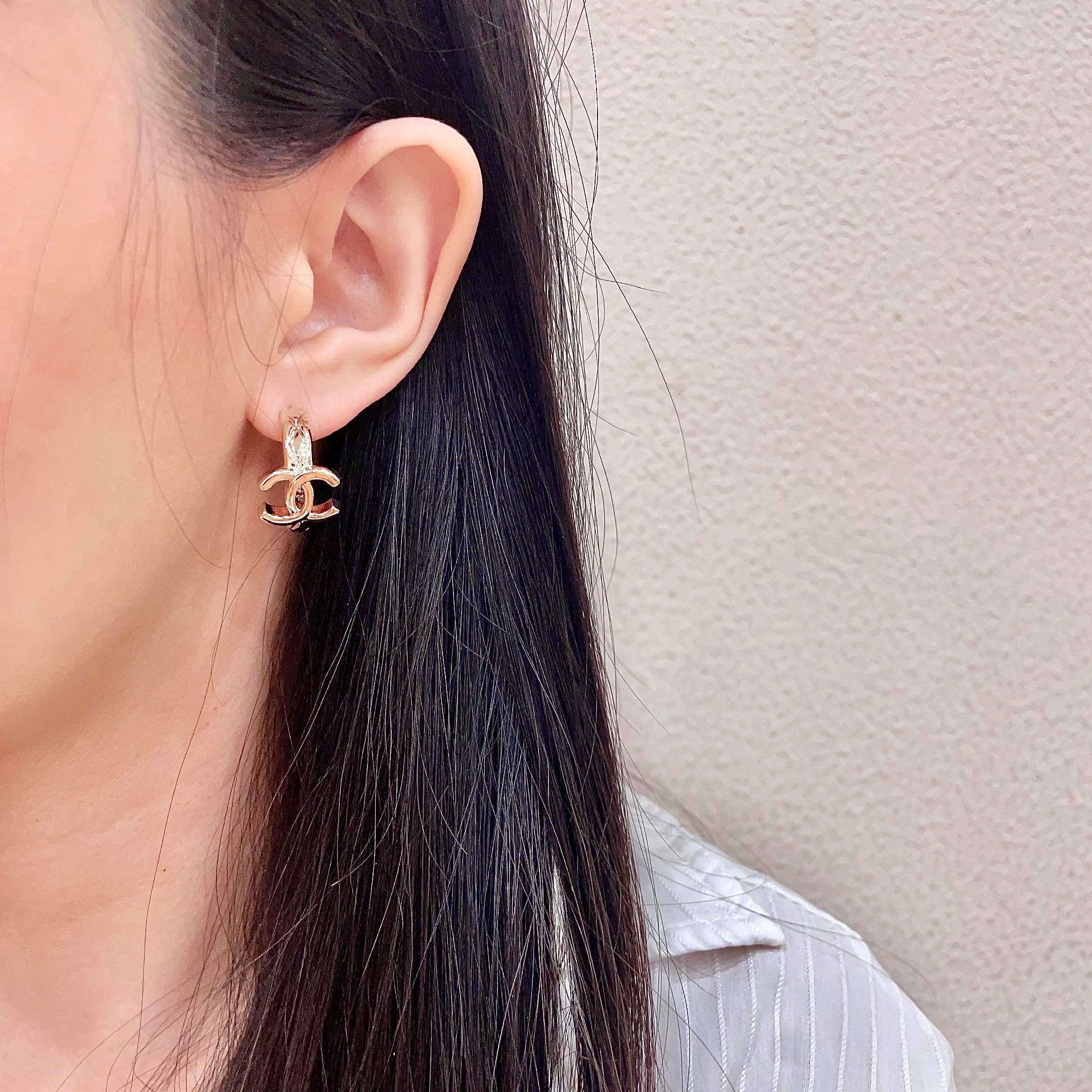Chanel CC Logo Huggie Earrings earrings light gold tone metal with clear crystal accents 1 5cm drop length
