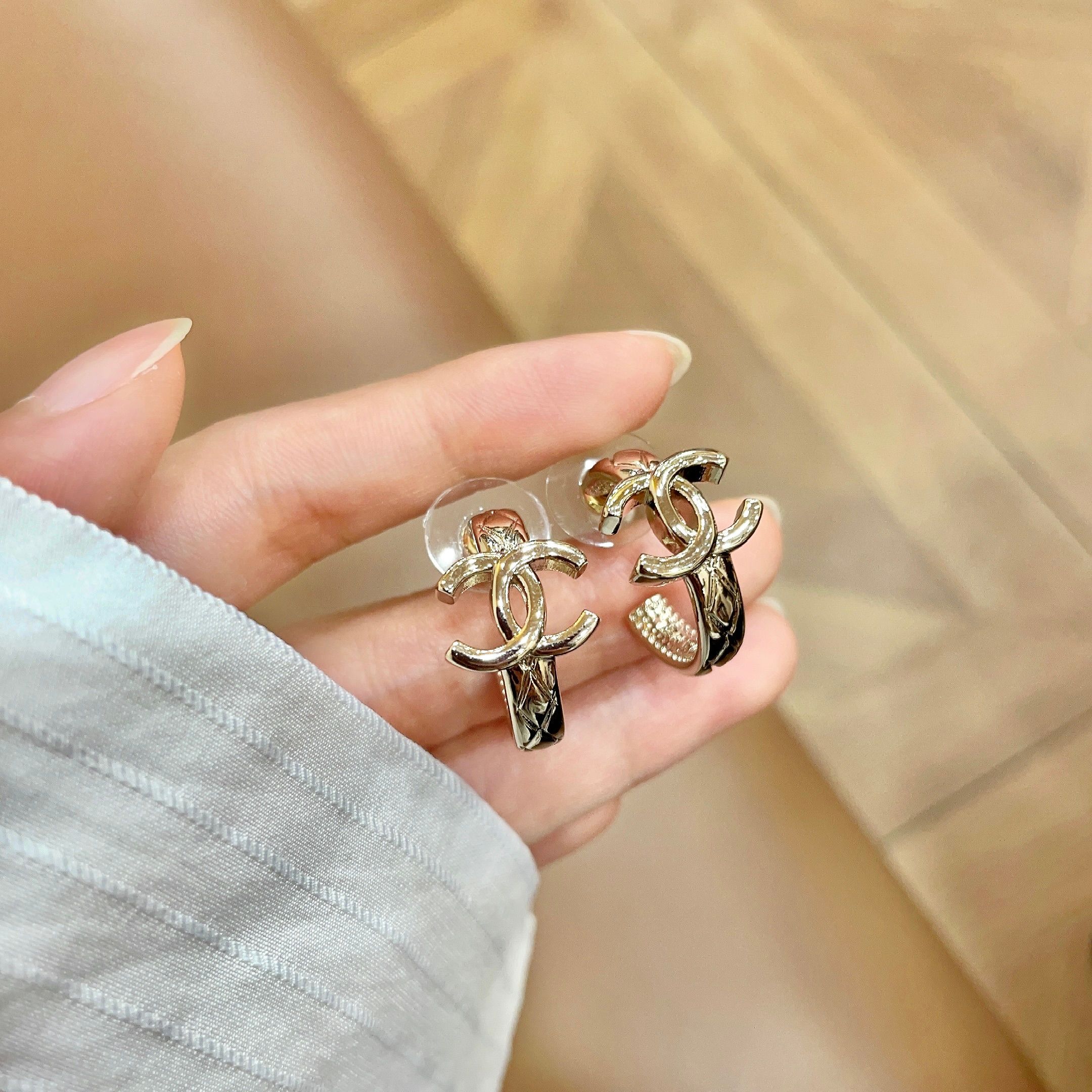 Chanel CC Logo Huggie Earrings earrings light gold tone metal with clear crystal accents 1 5cm drop length