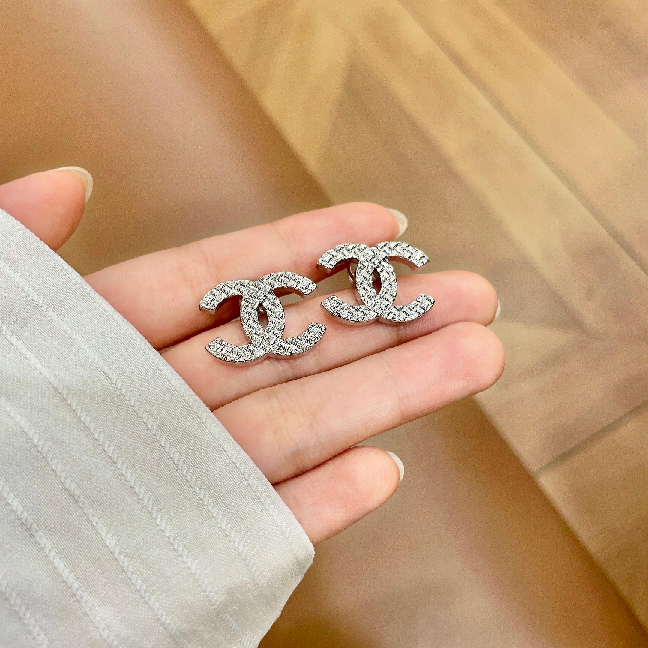 Chanel CC Quilted Stud Earrings earrings silver tone metal with textured quilted finish 1 5cm diameter