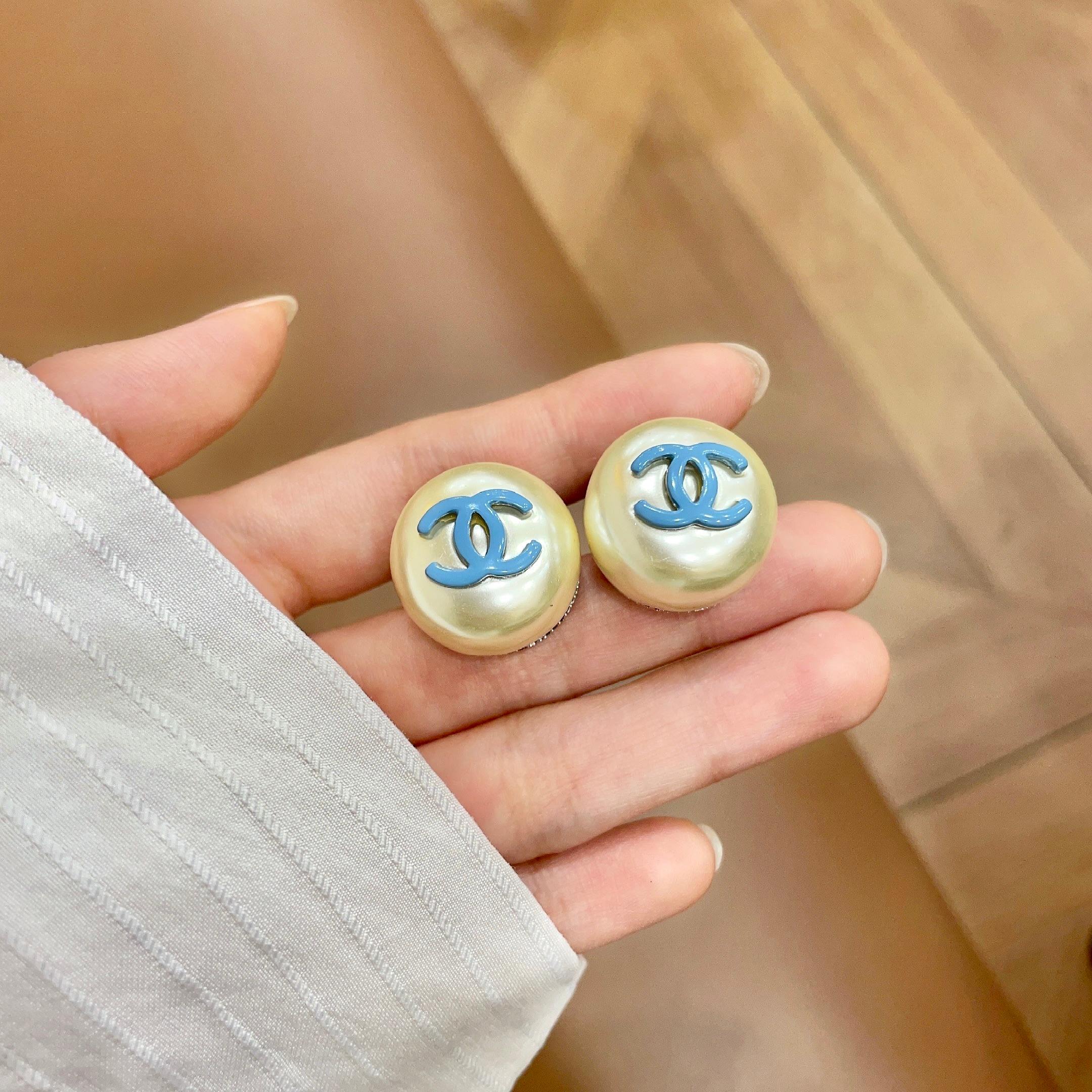 Chanel CC Logo Faux Pearl Stud Earrings earrings Cream faux pearl with light blue enamel CC logo gold-tone metal edge 2cm diameter