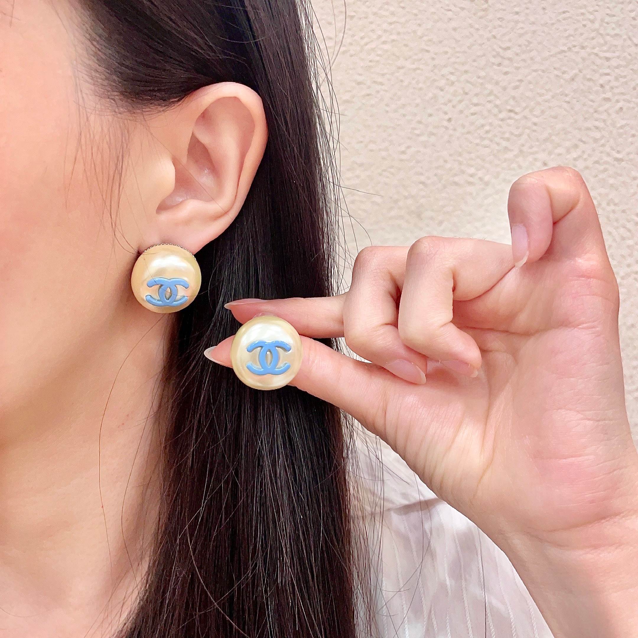 Chanel CC Logo Faux Pearl Stud Earrings earrings Cream faux pearl with light blue enamel CC logo gold-tone metal edge 2cm diameter