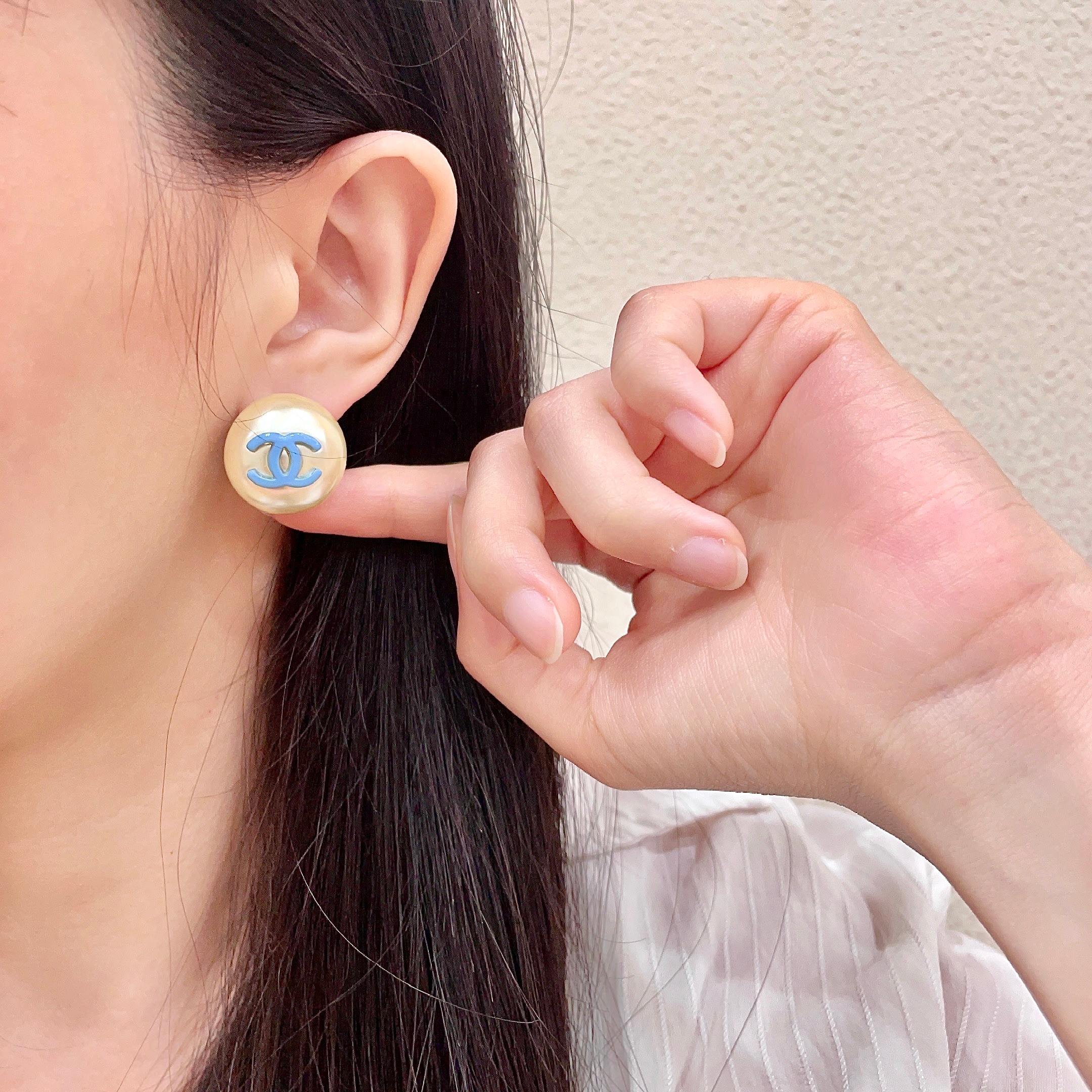 Chanel CC Logo Faux Pearl Stud Earrings earrings Cream faux pearl with light blue enamel CC logo gold-tone metal edge 2cm diameter