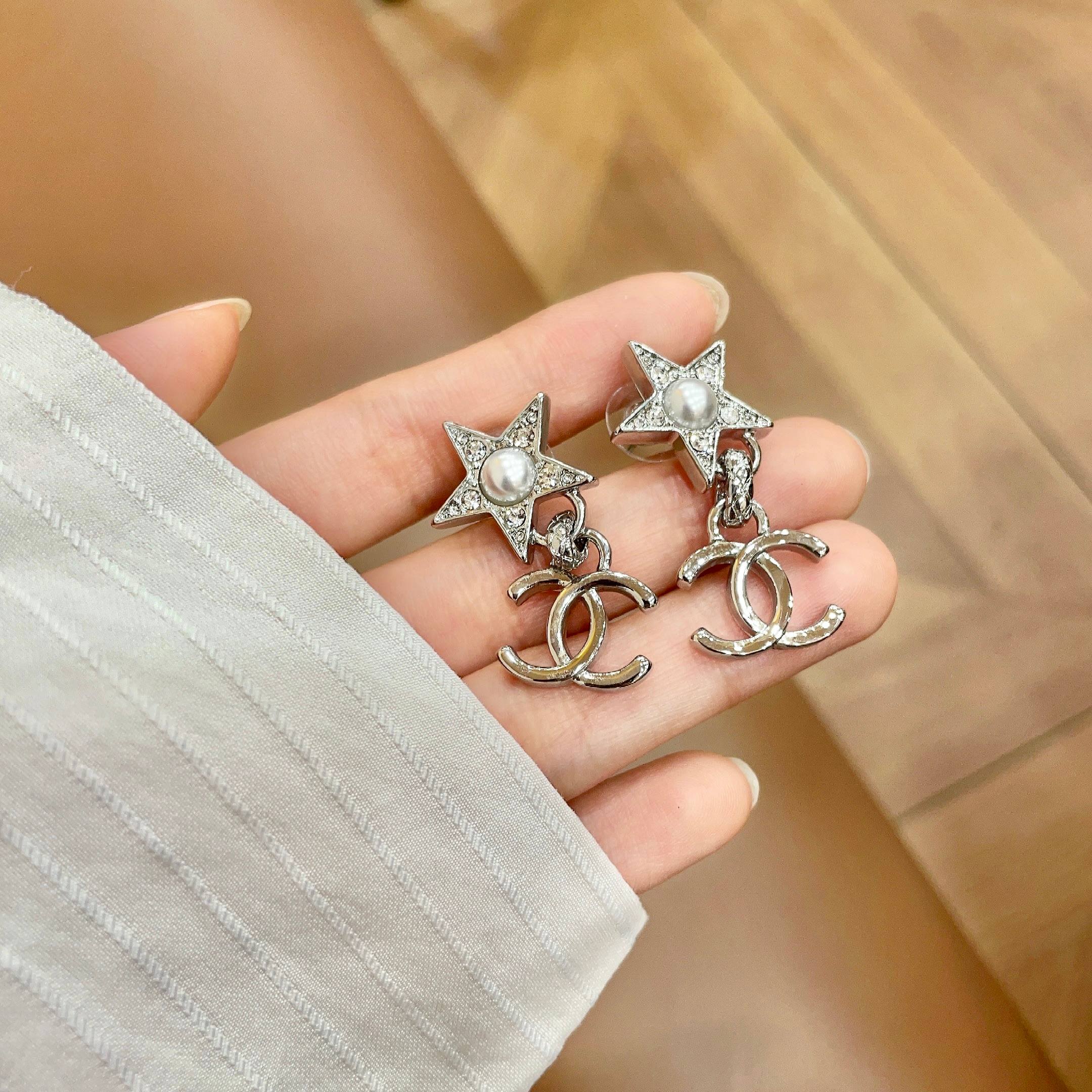 Chanel CC Star Drop Earrings earrings Silver-tone metal with clear crystals and white pearl accents One Size