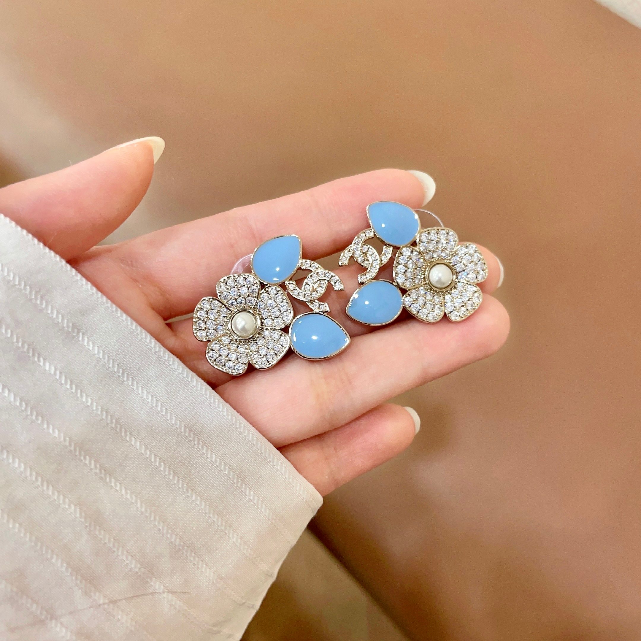 Chanel CC Logo Flower Enamel Stud Earrings earrings Gold-tone metal clear crystals white pearl center light blue enamel accents One Size 2 5cm width