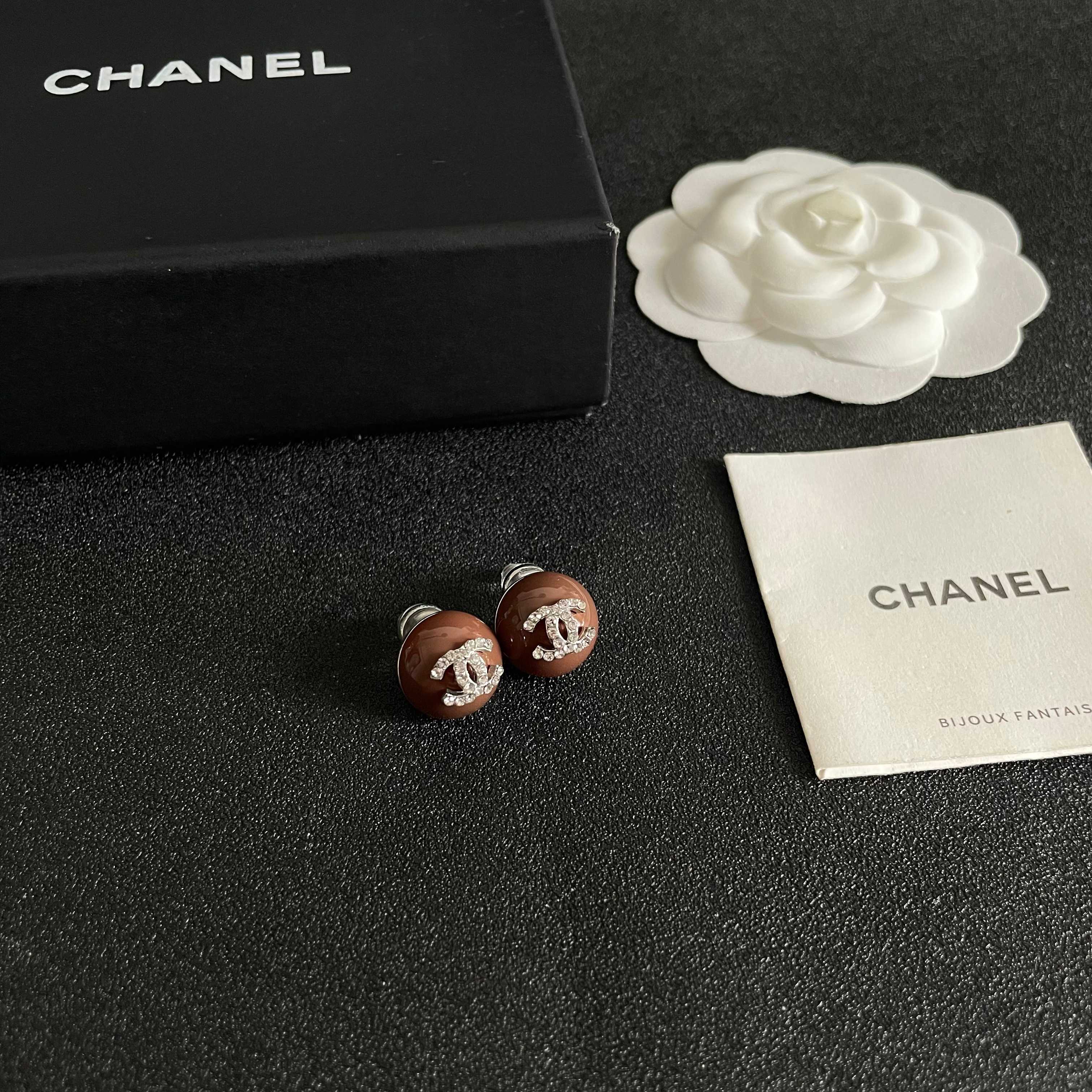 Chanel CC Logo Round Stud Earrings earrings brown resin base with silver-tone metal and clear crystal CC logo 1 2cm diameter