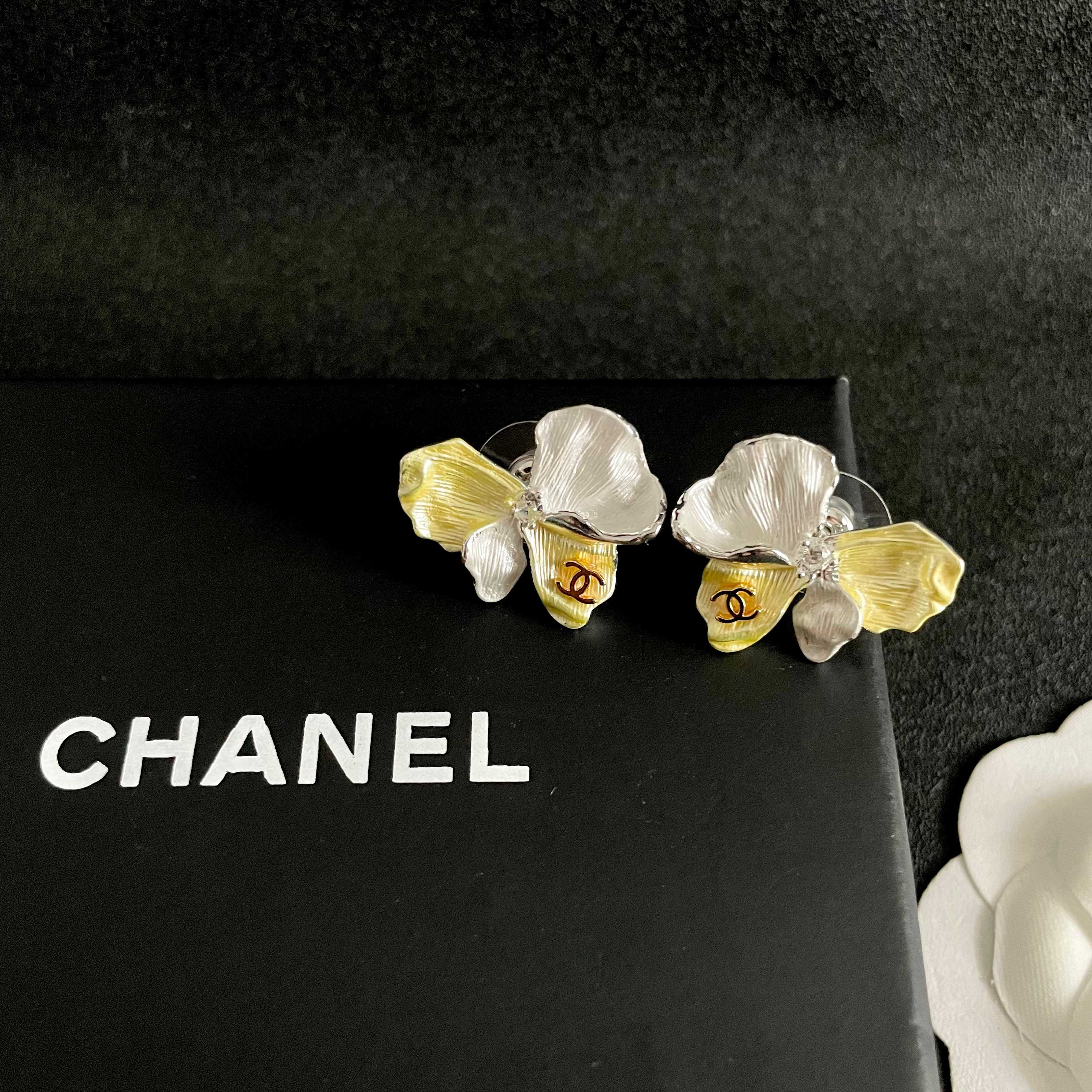 Chanel Four Petal Flower CC Stud Earrings earrings silver-toned metal pale yellow enamel pearlescent white enamel gold-tone CC logo clear crystal accent 2cm stud diameter