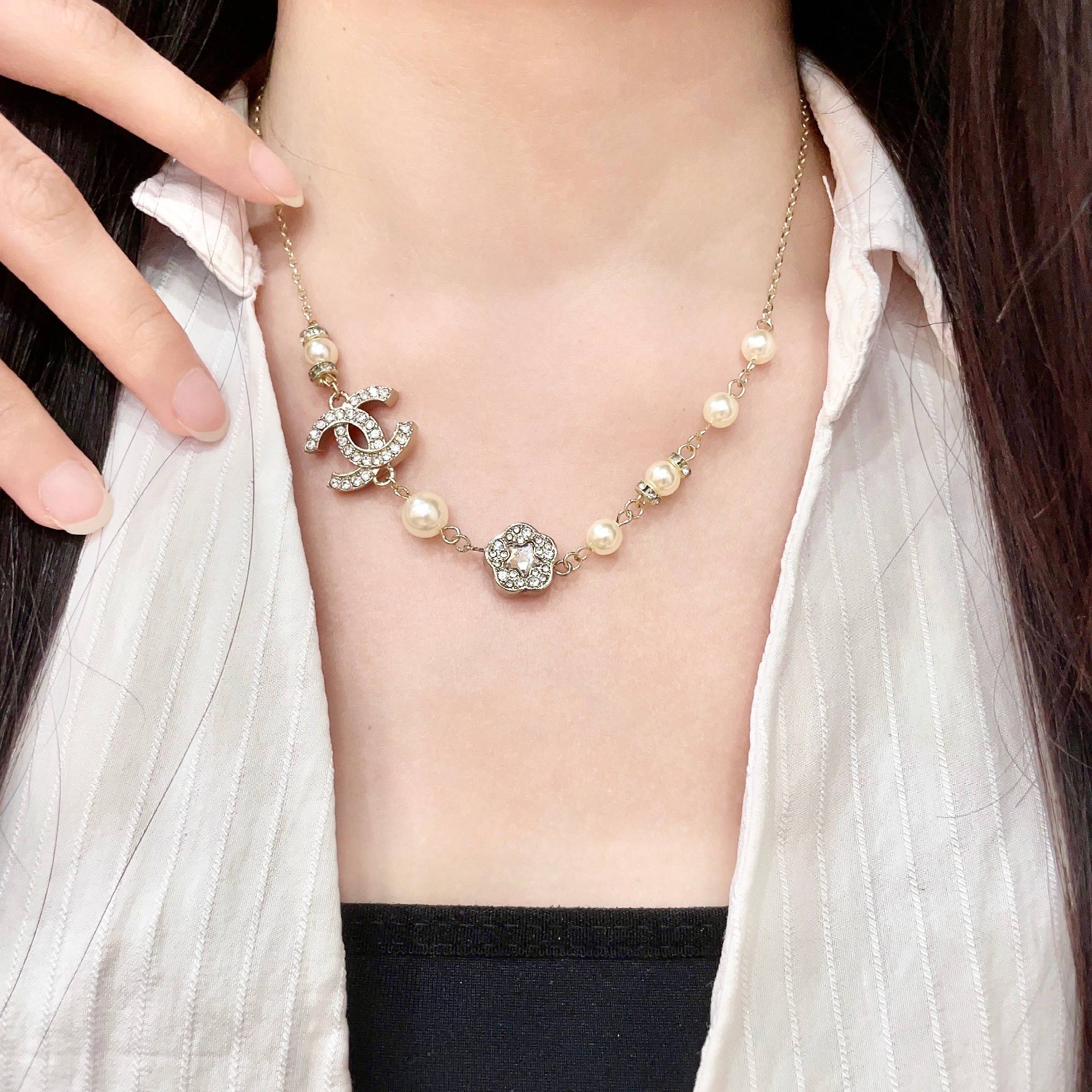 Chanel CC Camellia Pearl Crystal Necklace necklace Gold-tone metal cream faux pearl clear crystal 42cm
