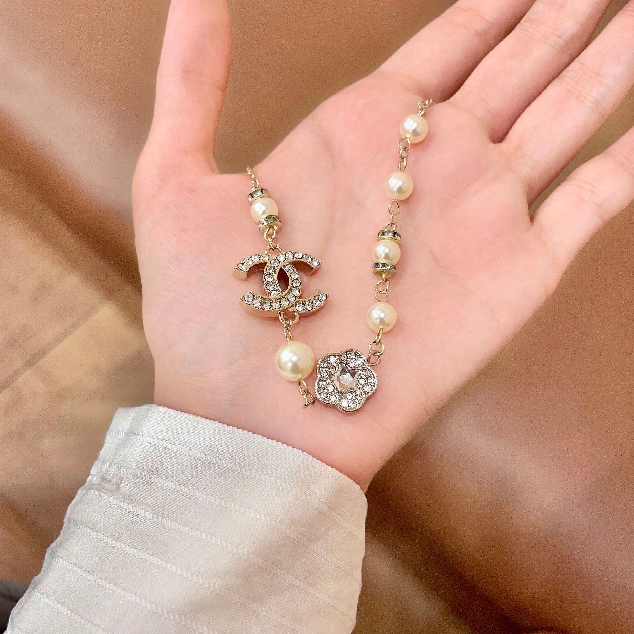 Chanel CC Camellia Pearl Crystal Necklace necklace Gold-tone metal cream faux pearl clear crystal 42cm
