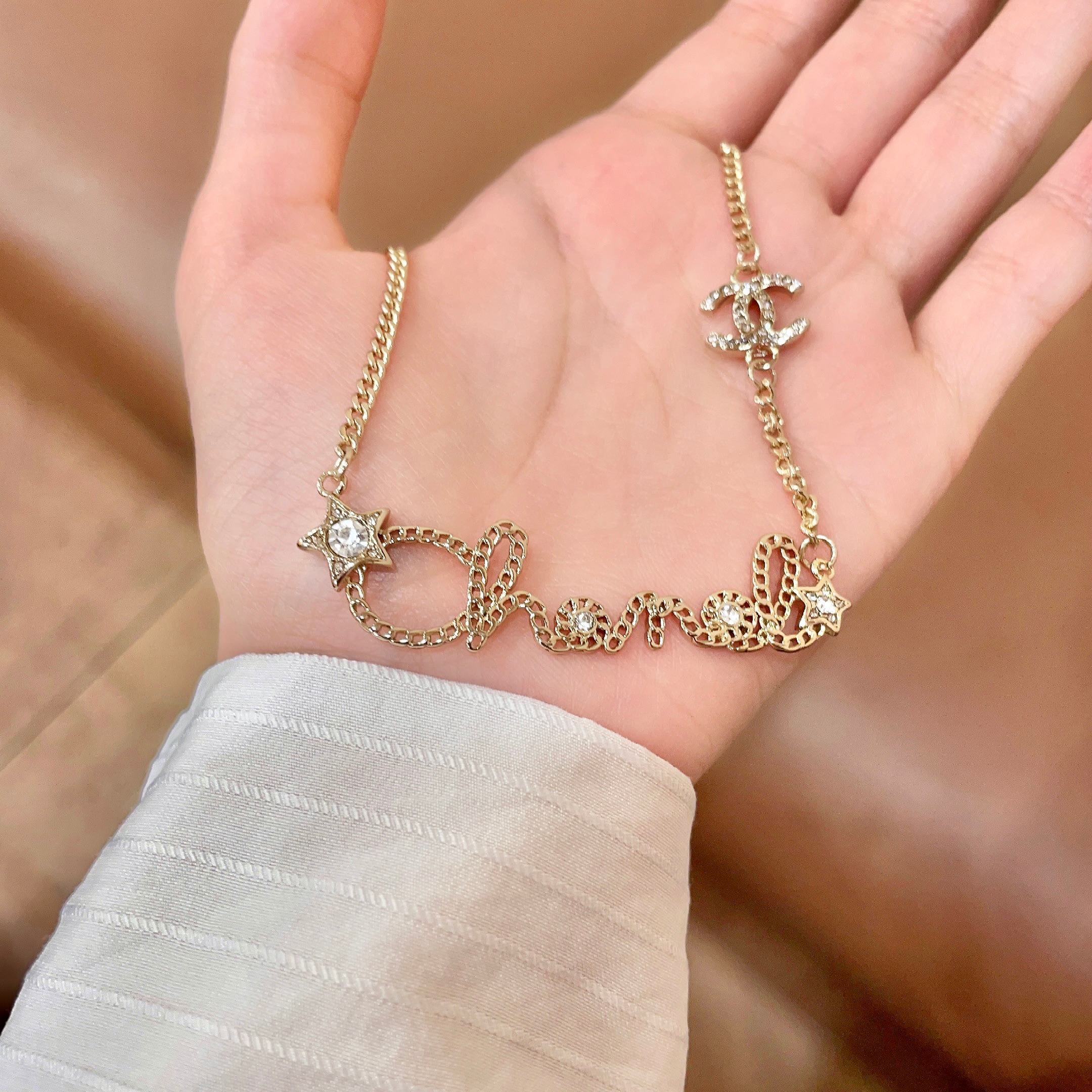 Chanel Script Logo Star Crystal CC Necklace necklace Gold-tone metal with clear crystal accents 42cm
