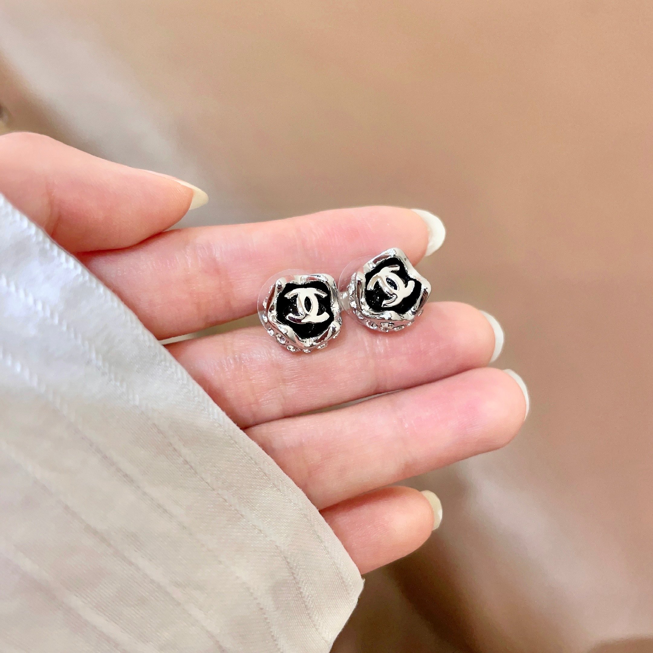 Chanel CC Logo Round Stud Earrings earrings Silver-tone metal with black enamel and silver interlocking CC logo 1cm diameter