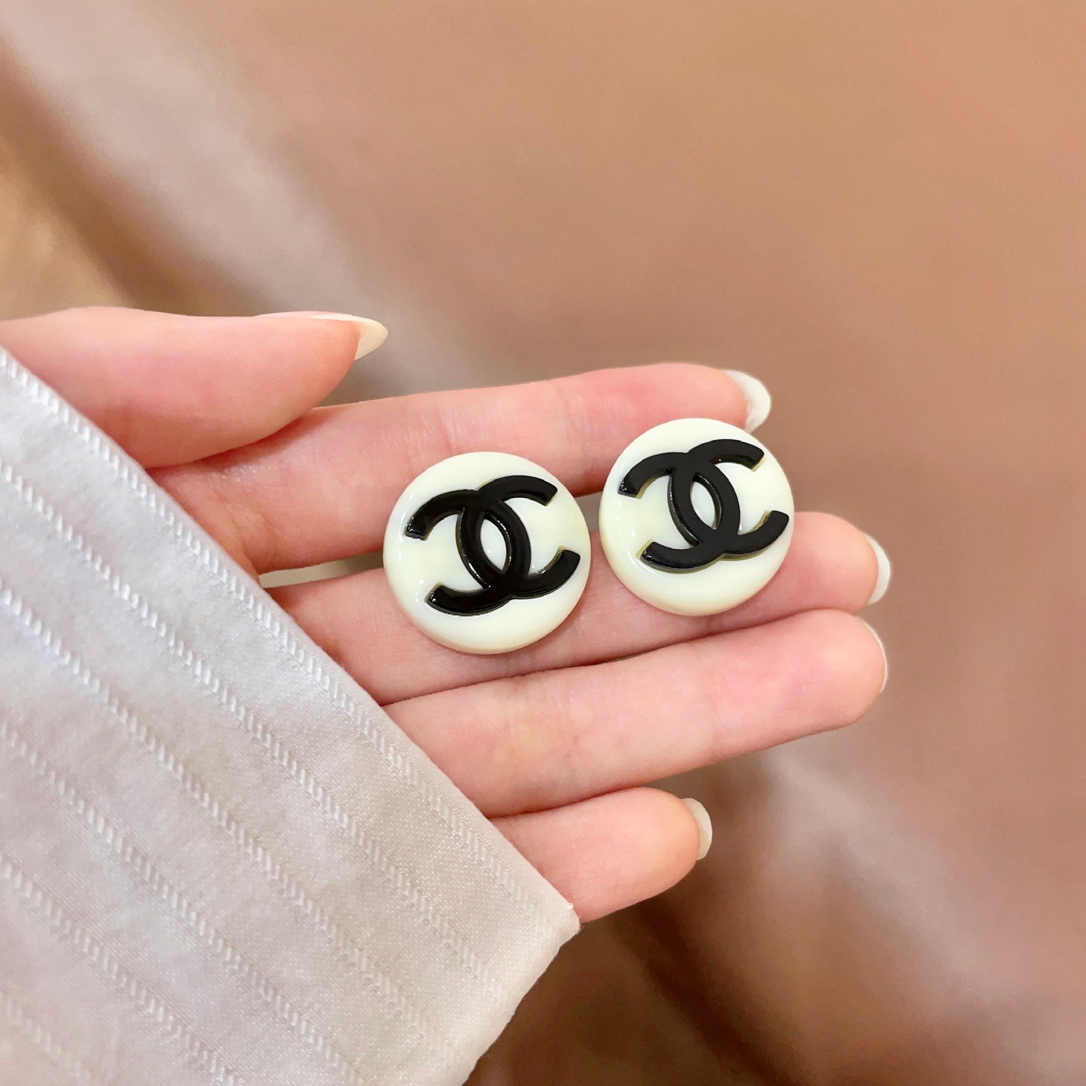 Chanel CC Logo Round Stud Earrings earrings Cream white resin base with black enamel CC logo 2cm diameter
