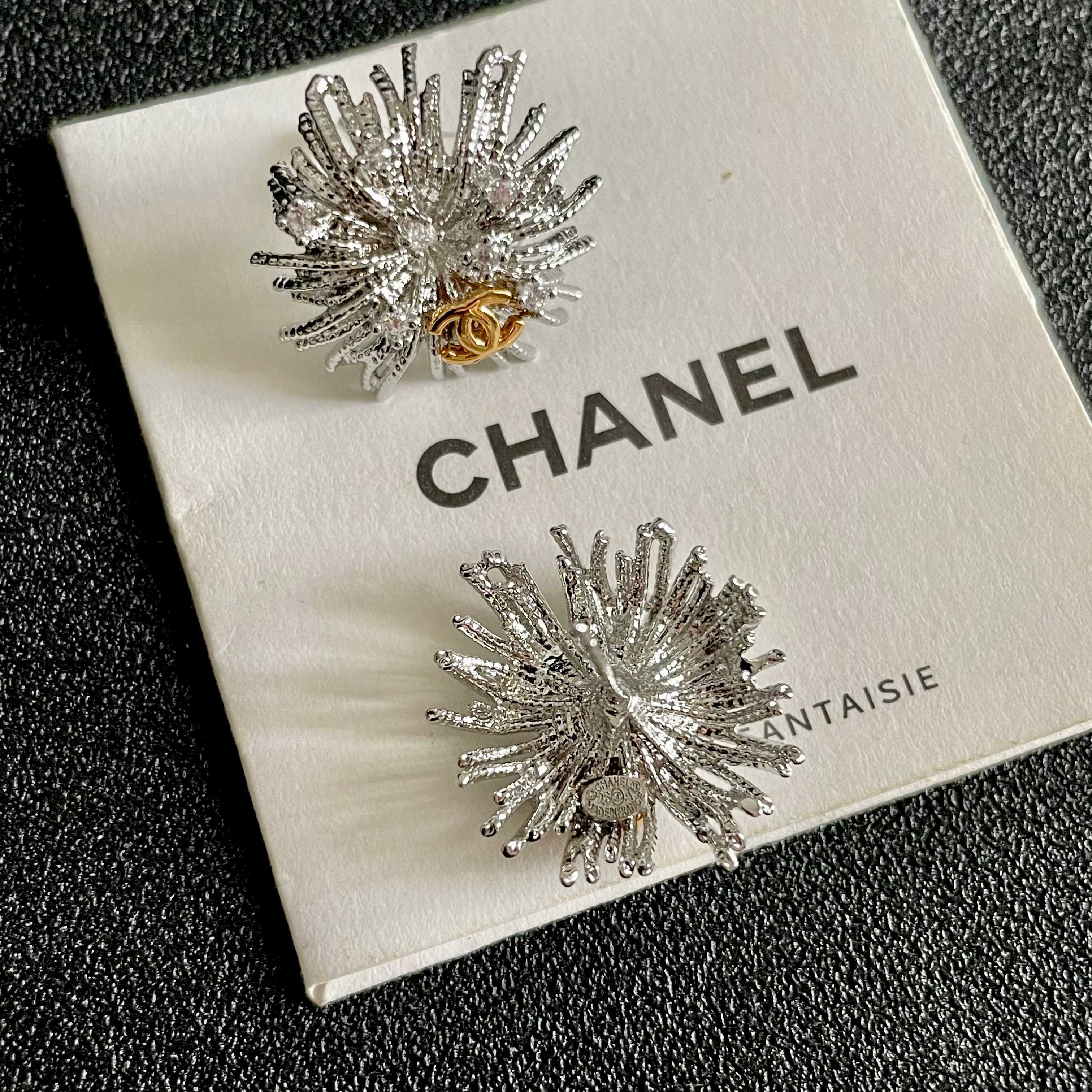 Chanel CC Sunburst Stud Earrings earrings silver-tone metal with clear crystal accents and gold-tone interlocking CC logo 2cm diameter
