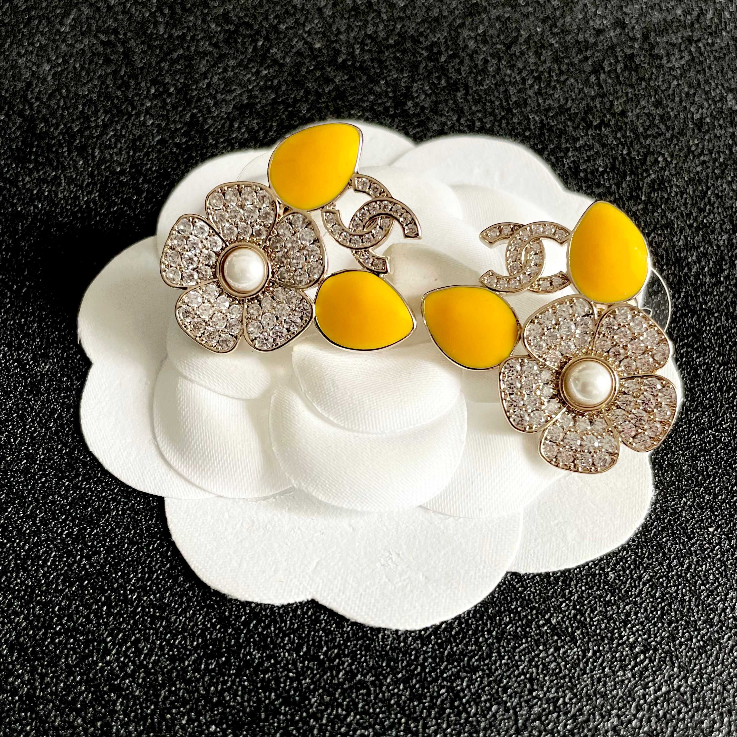 Chanel CC Logo Crystal Flower Yellow Enamel Stud Earrings earrings Gold-tone metal clear crystal white faux pearl bright yellow enamel 2 5cm diameter per earring