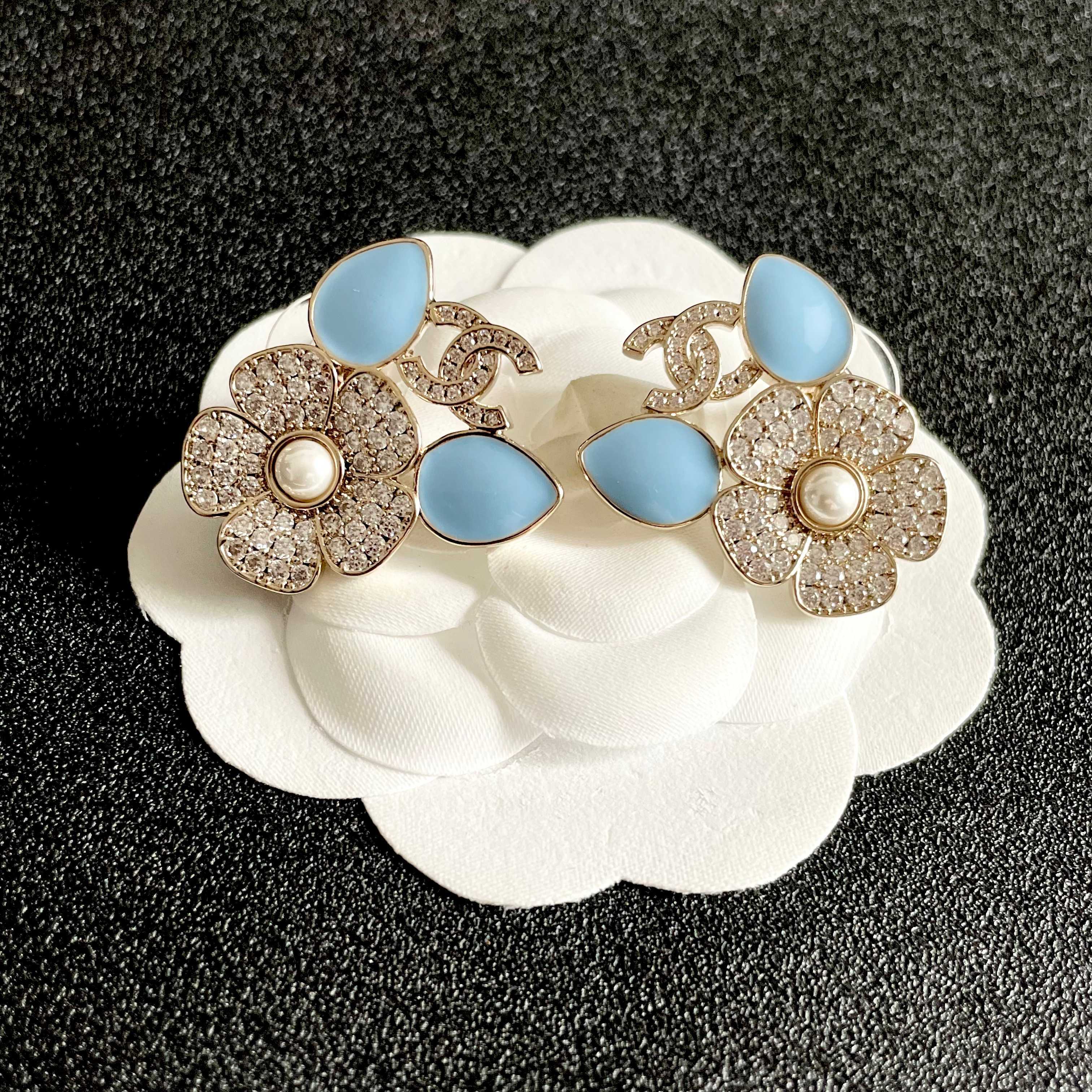 Chanel CC Logo Flower Enamel Stud Earrings earrings Gold-tone metal clear crystals white pearl center light blue enamel accents One Size 2 5cm width