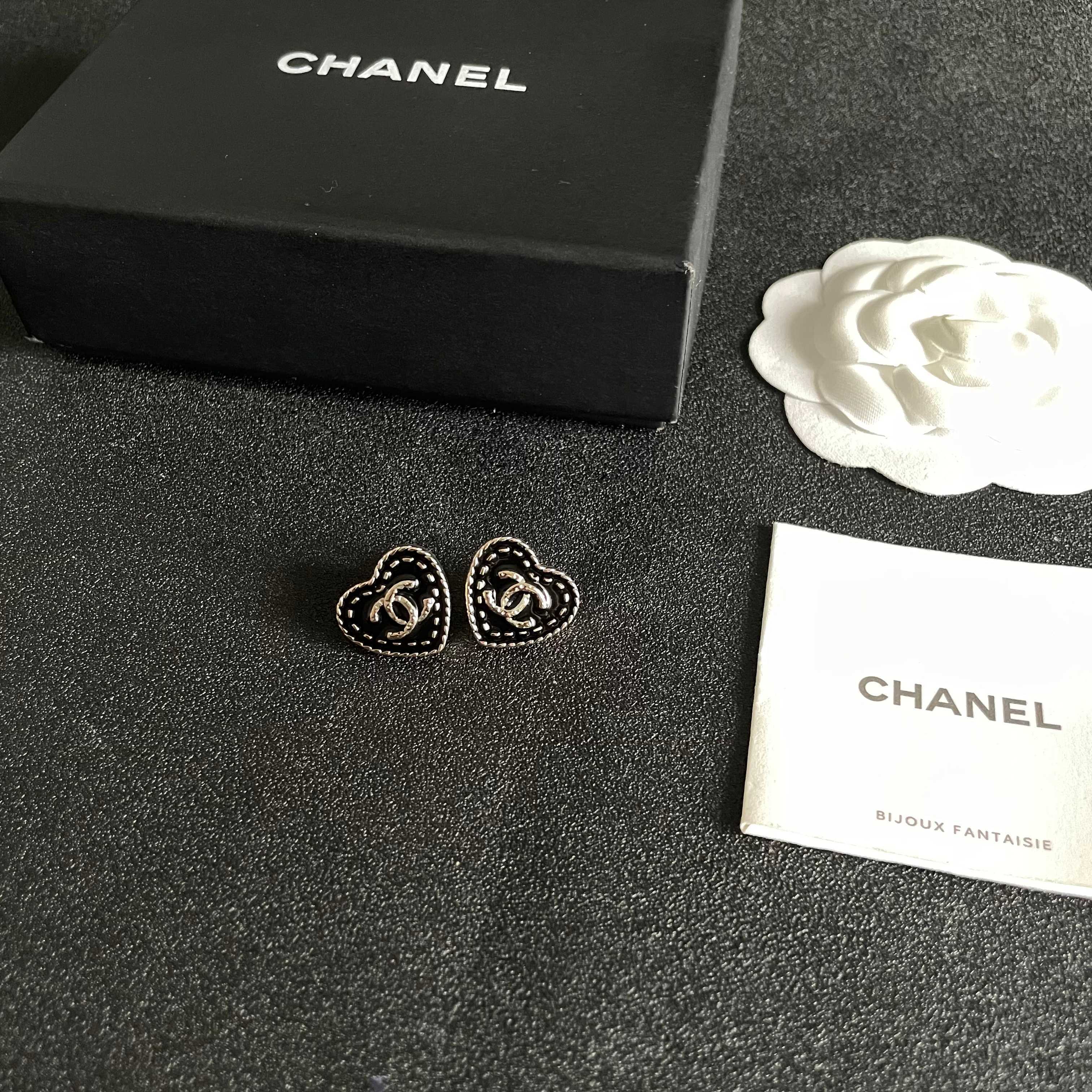 Chanel CC Heart Stud Earrings earrings light gold tone metal with black enamel and silver-tone interlocking CC logo 1 5cm diameter