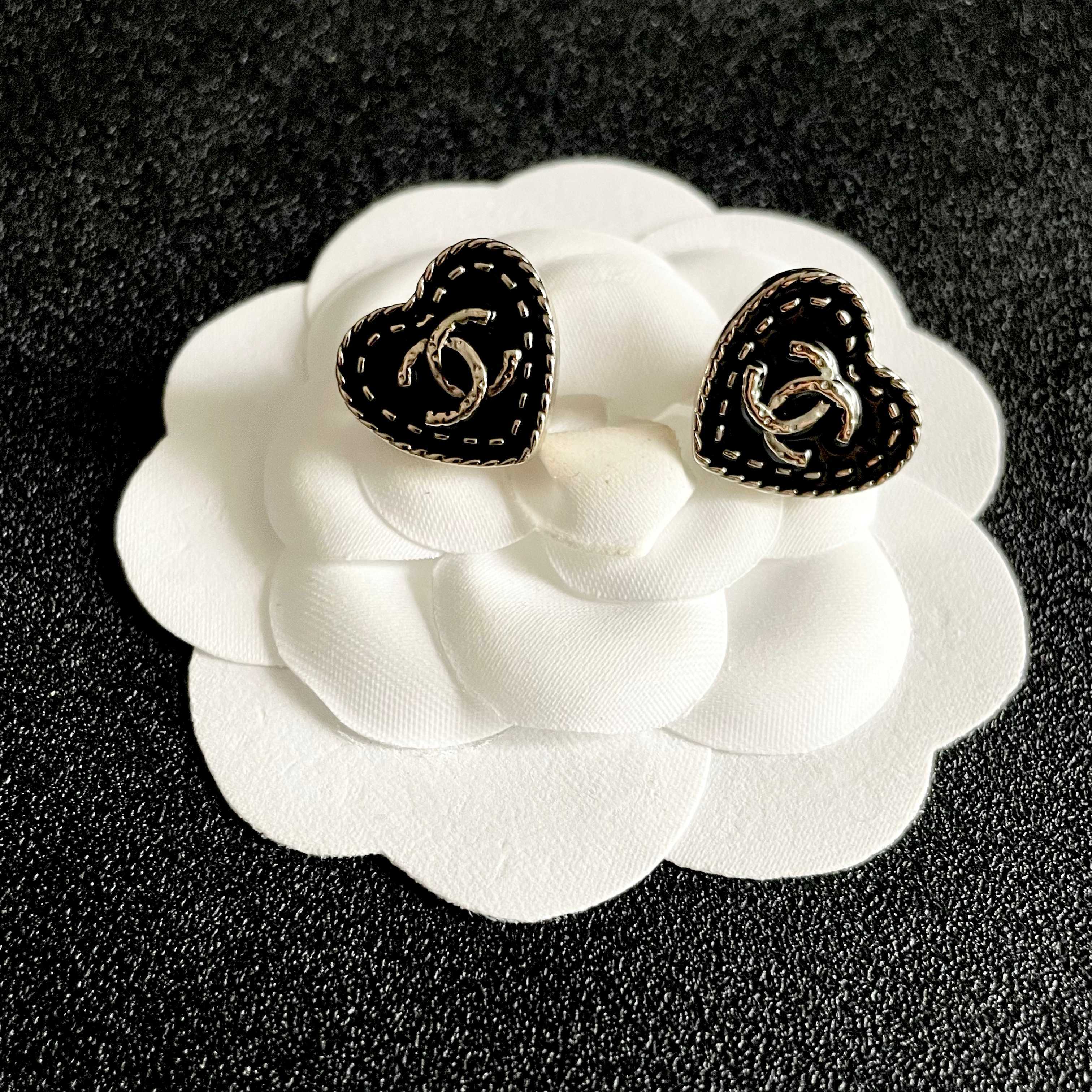 Chanel CC Heart Stud Earrings earrings light gold tone metal with black enamel and silver-tone interlocking CC logo 1 5cm diameter