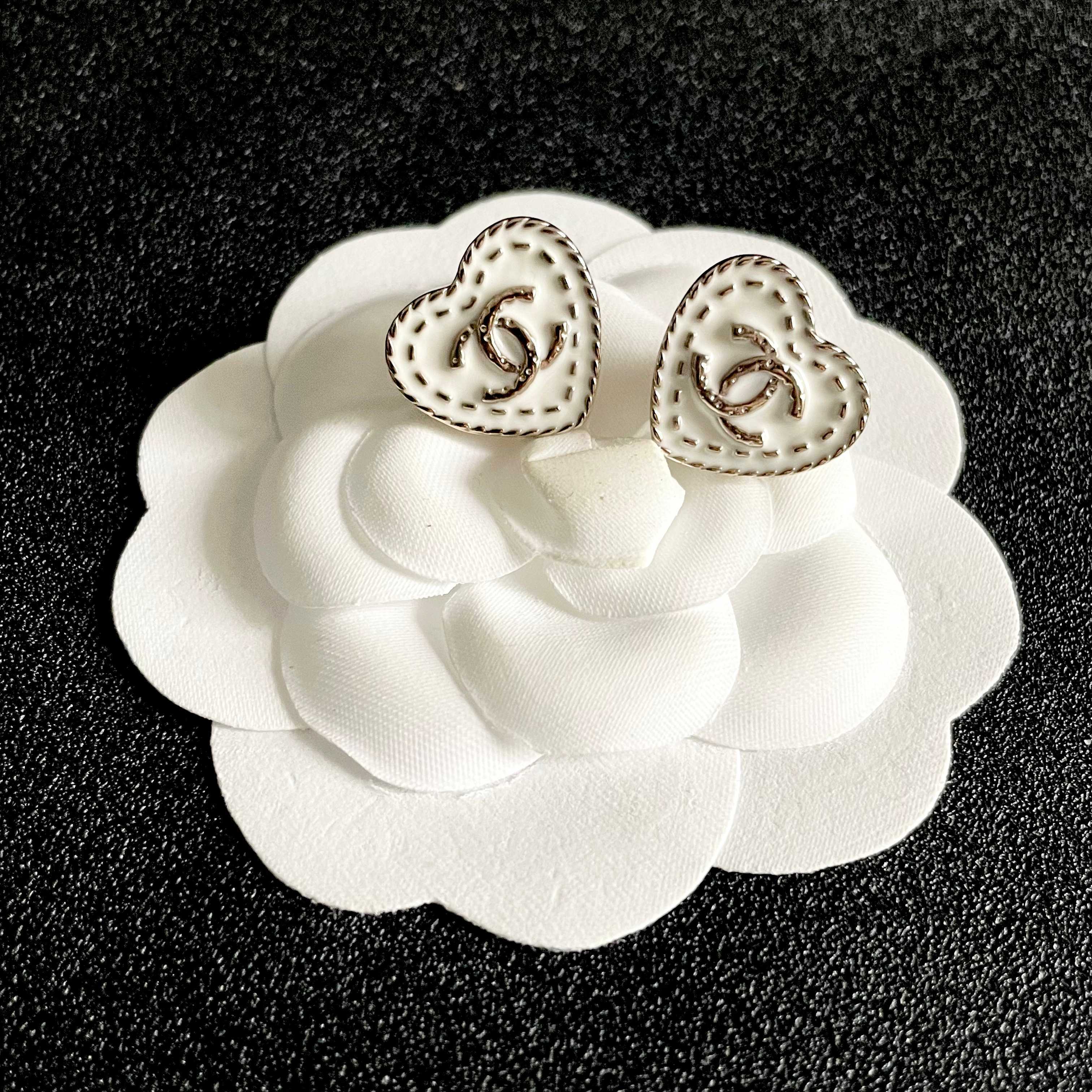 Chanel CC Heart Stitch Stud Earrings earrings light gold tone metal with white enamel and crystal accents 1 5cm stud diameter