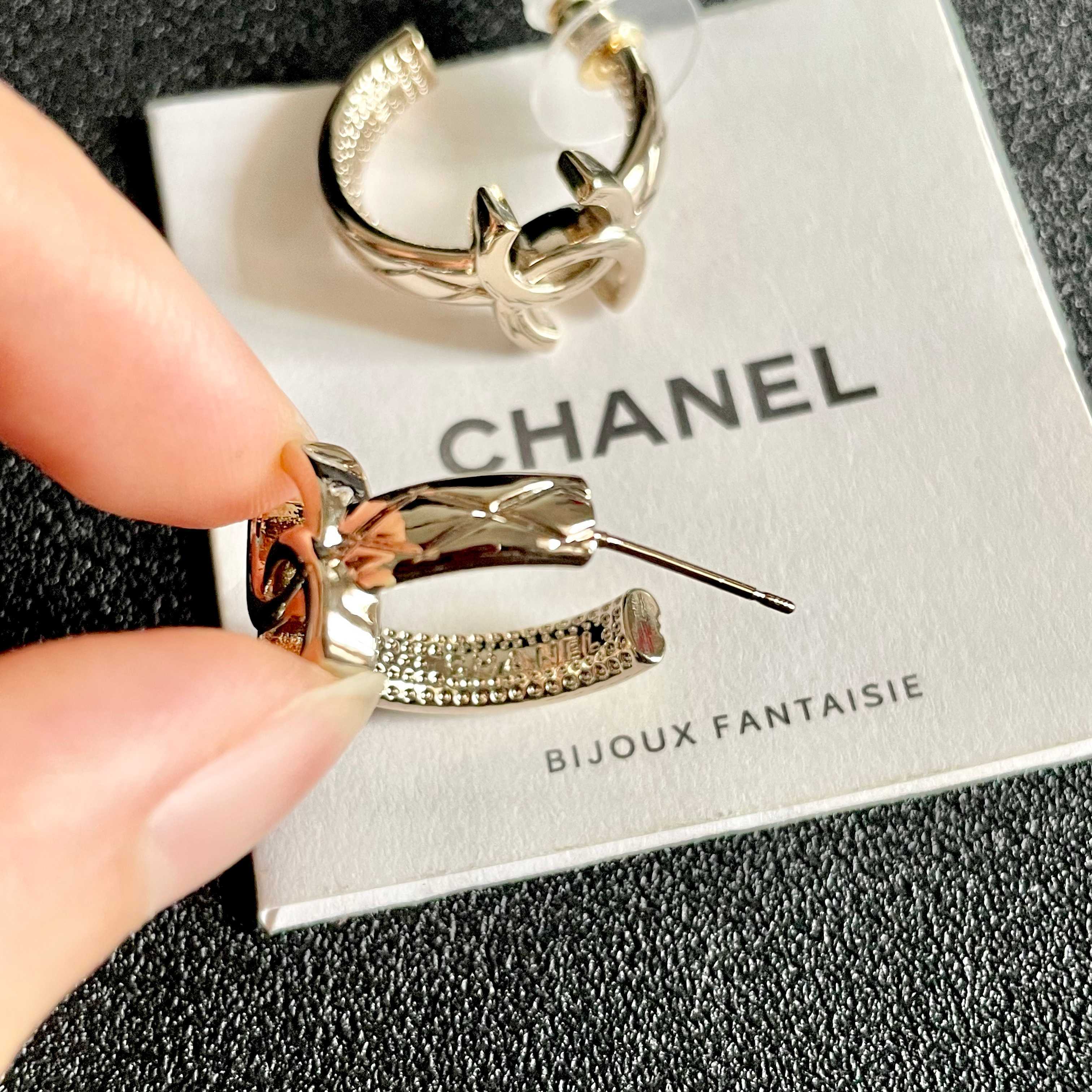 Chanel CC Logo Huggie Earrings earrings light gold tone metal with clear crystal accents 1 5cm drop length