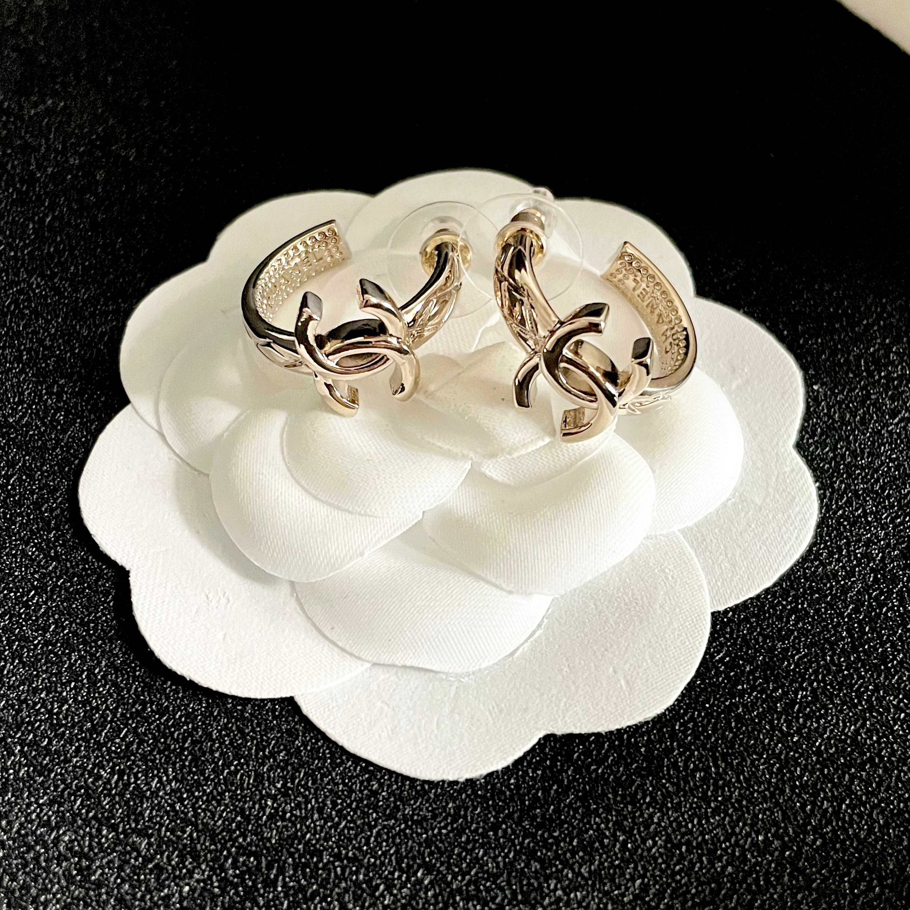 Chanel CC Logo Huggie Earrings earrings light gold tone metal with clear crystal accents 1 5cm drop length