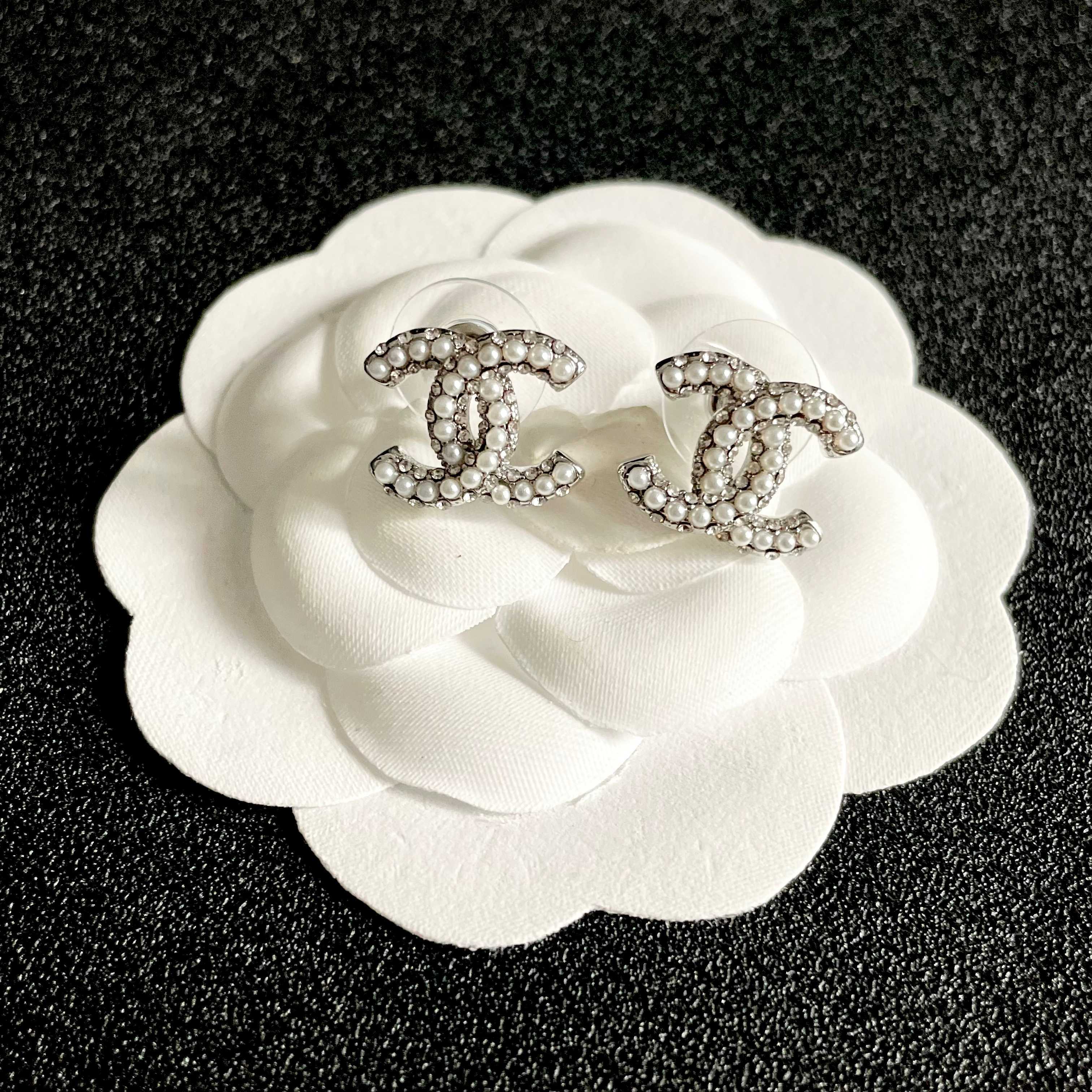Chanel CC Logo Stud Earrings earrings silver-tone metal with clear crystal and white pearl embellishments 1 2cm diameter per earring