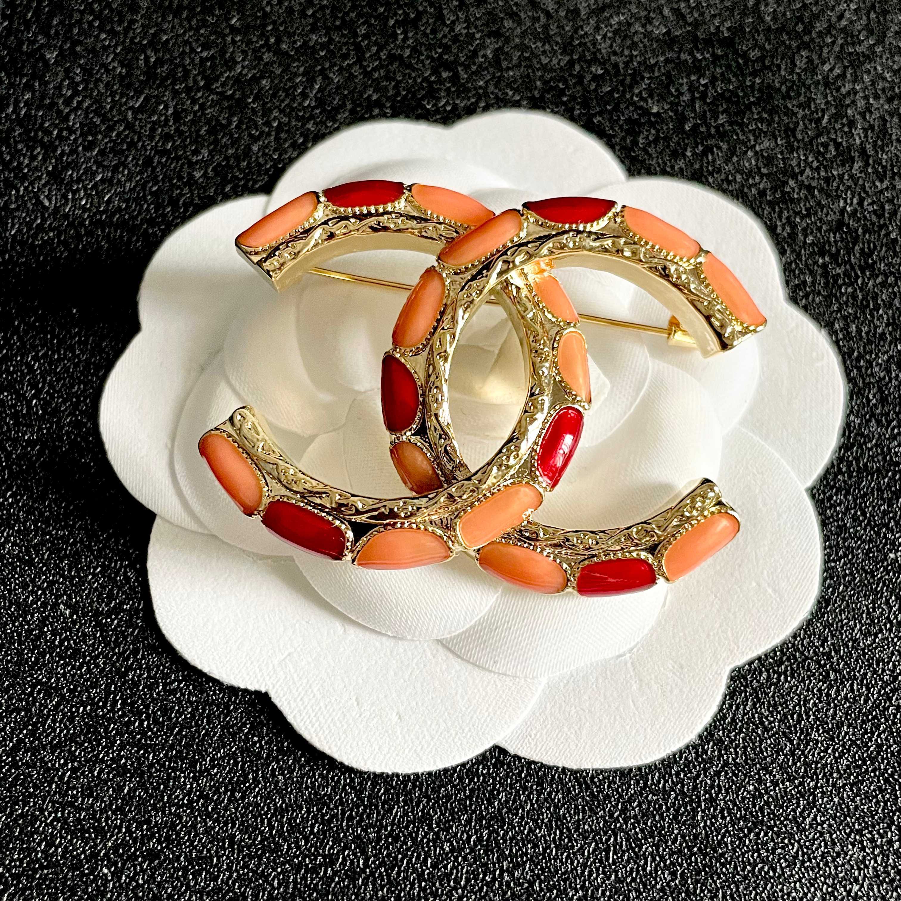 Chanel CC Logo Enamel Brooch brooch gold-tone metal with coral orange and red enamel 3 5cm width