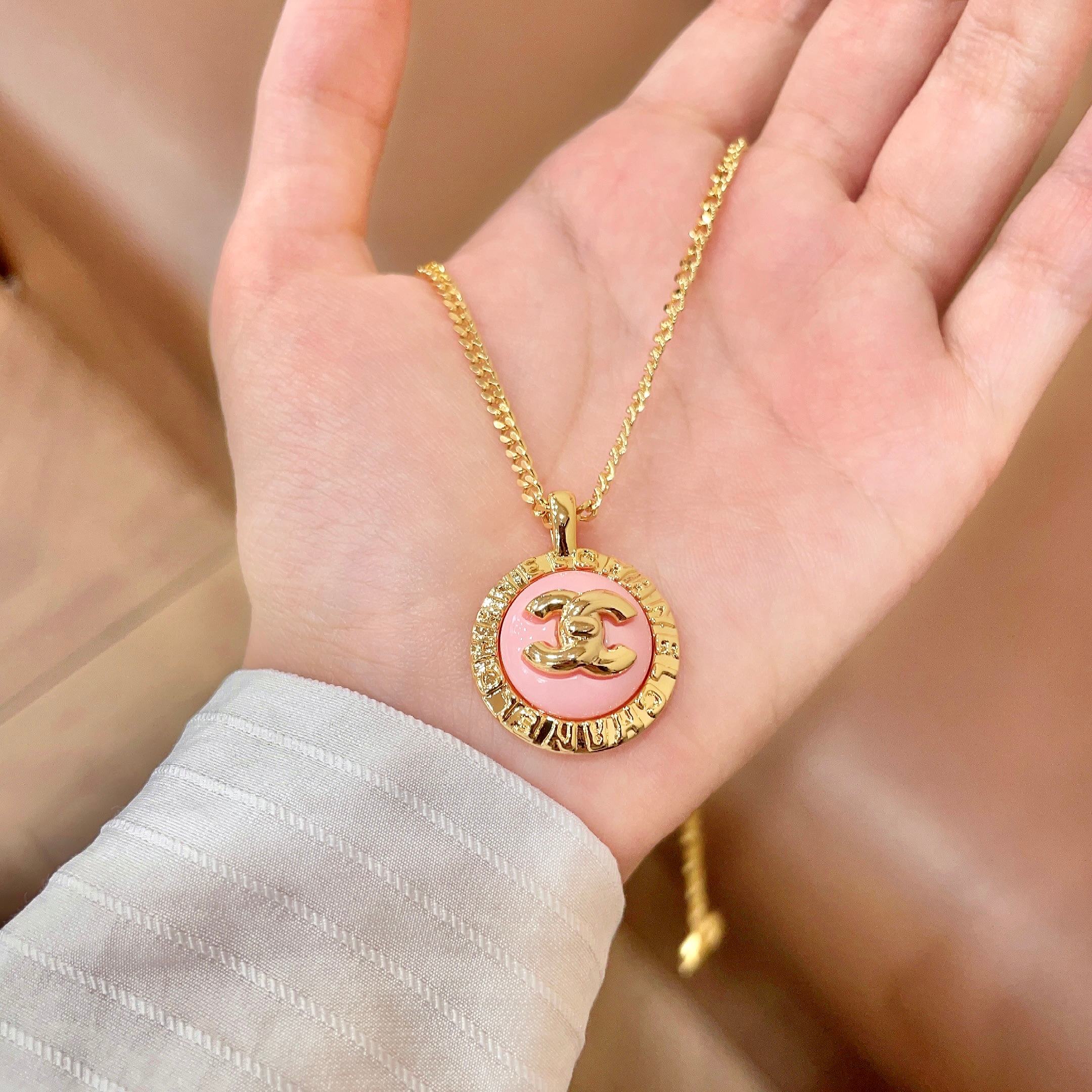 Chanel CC Logo Round Pendant necklace Gold-tone metal with pink enamel 42cm