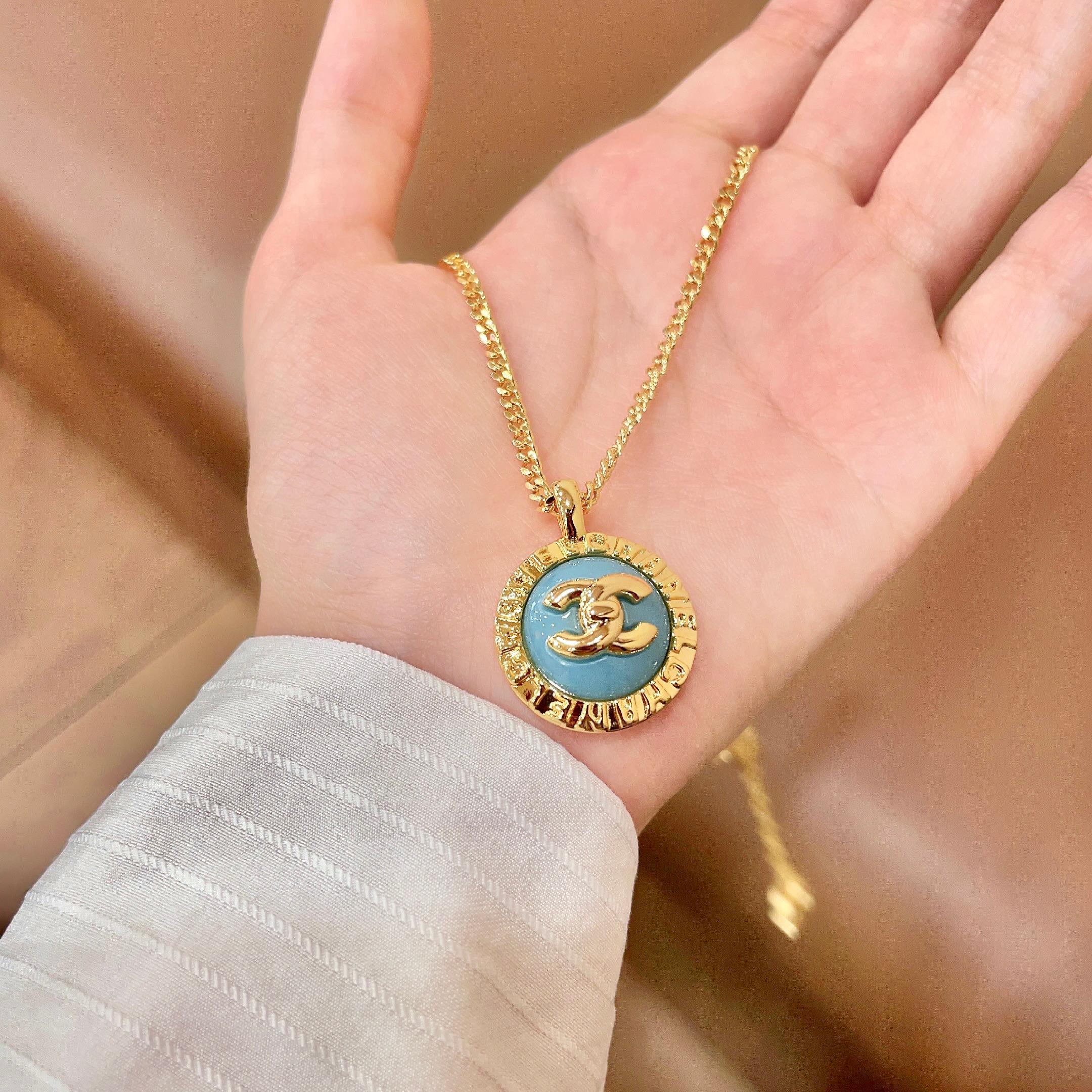 Chanel CC Logo Round Enamel Pendant necklace Gold-tone metal with light blue enamel 42cm