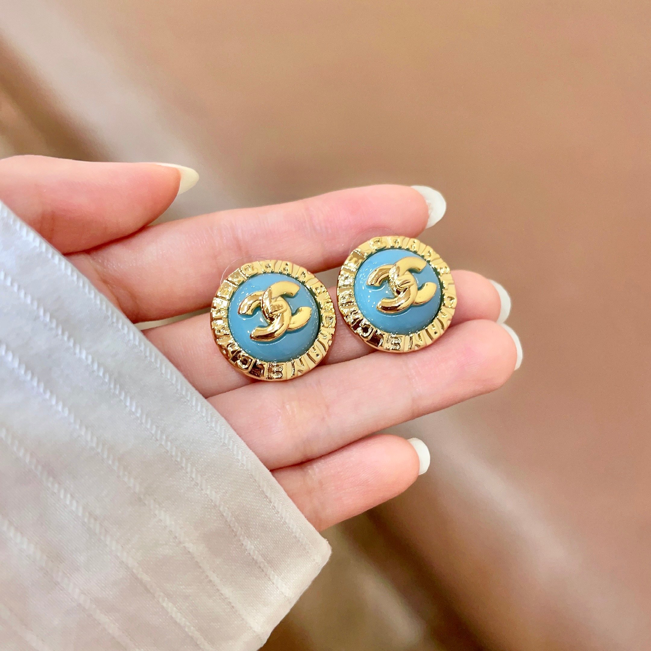 Chanel CC Logo Round Enamel Stud Earrings earrings Gold-tone metal with light blue enamel 1 5cm diameter