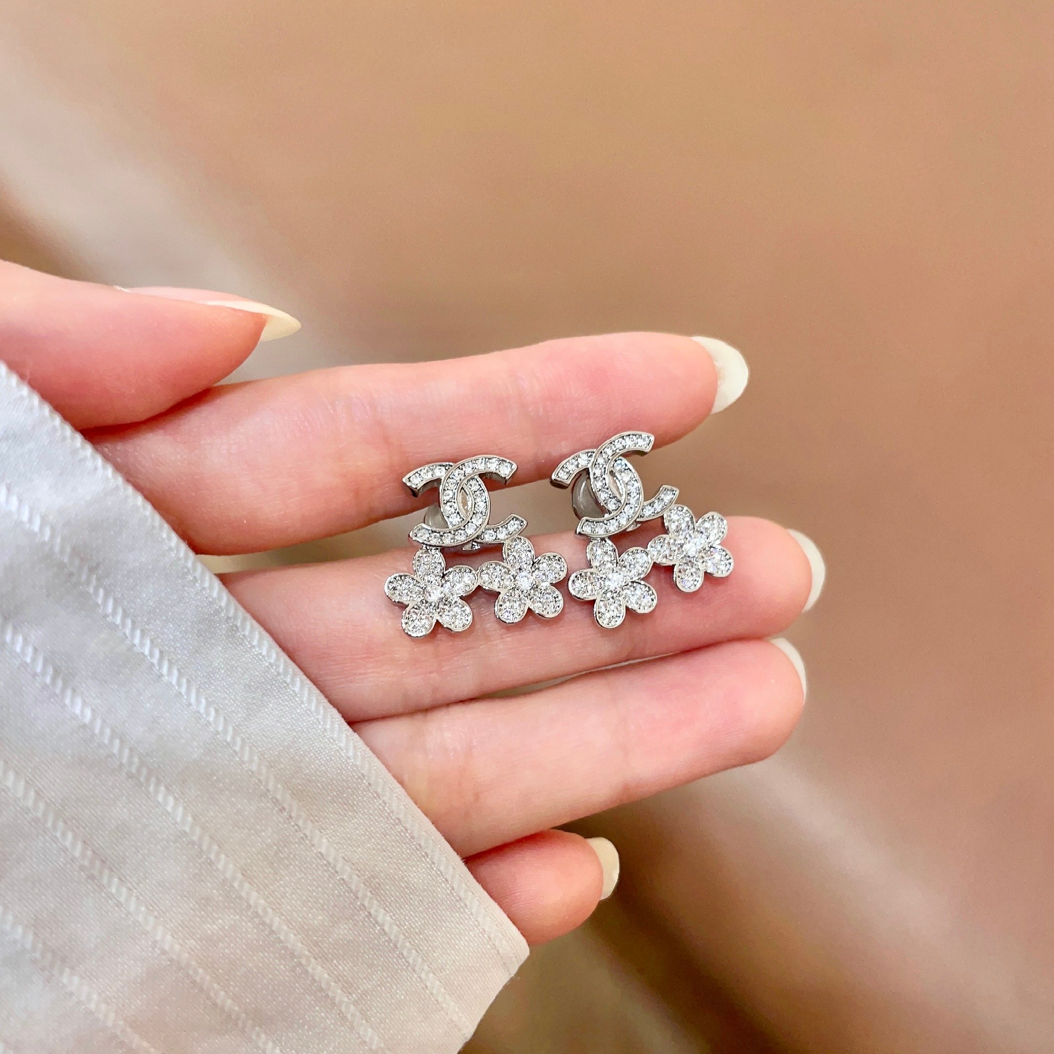 Chanel CC Logo Flower Drop Earrings earrings Silver-tone metal with clear crystal accents Gold-tone metal with clear crystal accents 1 5cm drop length