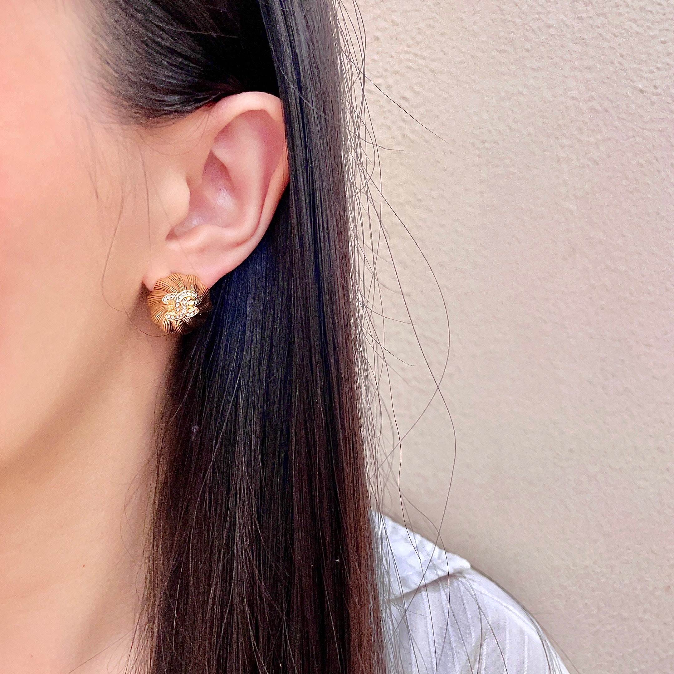 Chanel CC Logo Textured Flower Stud Earrings earrings Gold-tone metal with clear crystal accents 1 5cm diameter