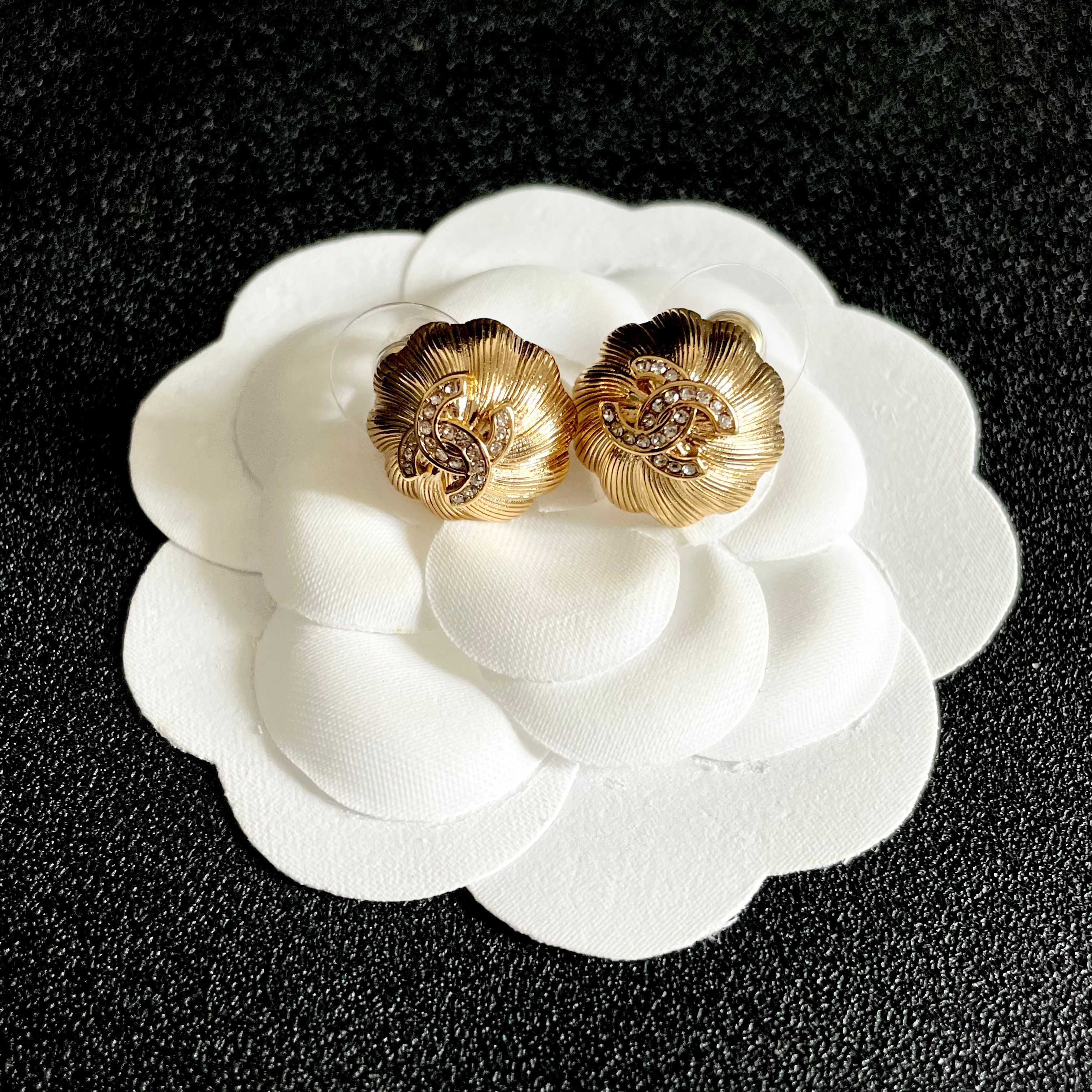Chanel CC Logo Textured Flower Stud Earrings earrings Gold-tone metal with clear crystal accents 1 5cm diameter