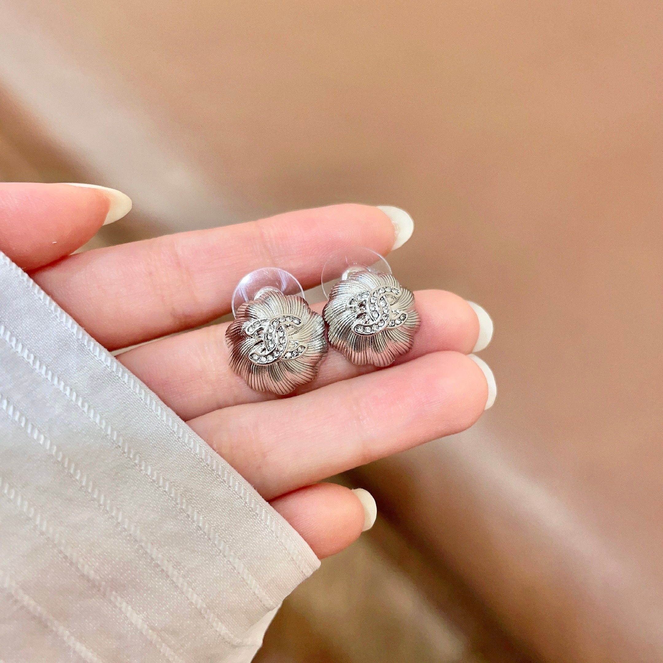 Chanel CC Camellia Stud Earrings earrings Gold-tone metal with clear crystal accents Silver-tone metal with clear crystal accents 1 2cm diameter