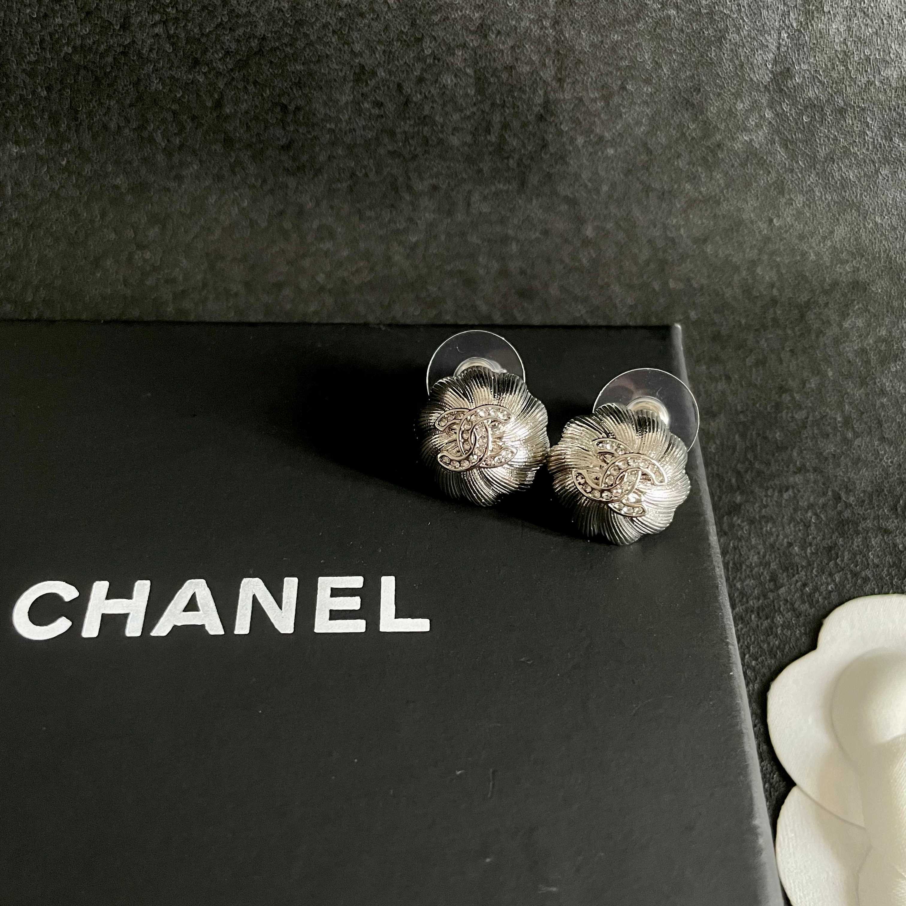 Chanel CC Camellia Stud Earrings earrings Gold-tone metal with clear crystal accents Silver-tone metal with clear crystal accents 1 2cm diameter