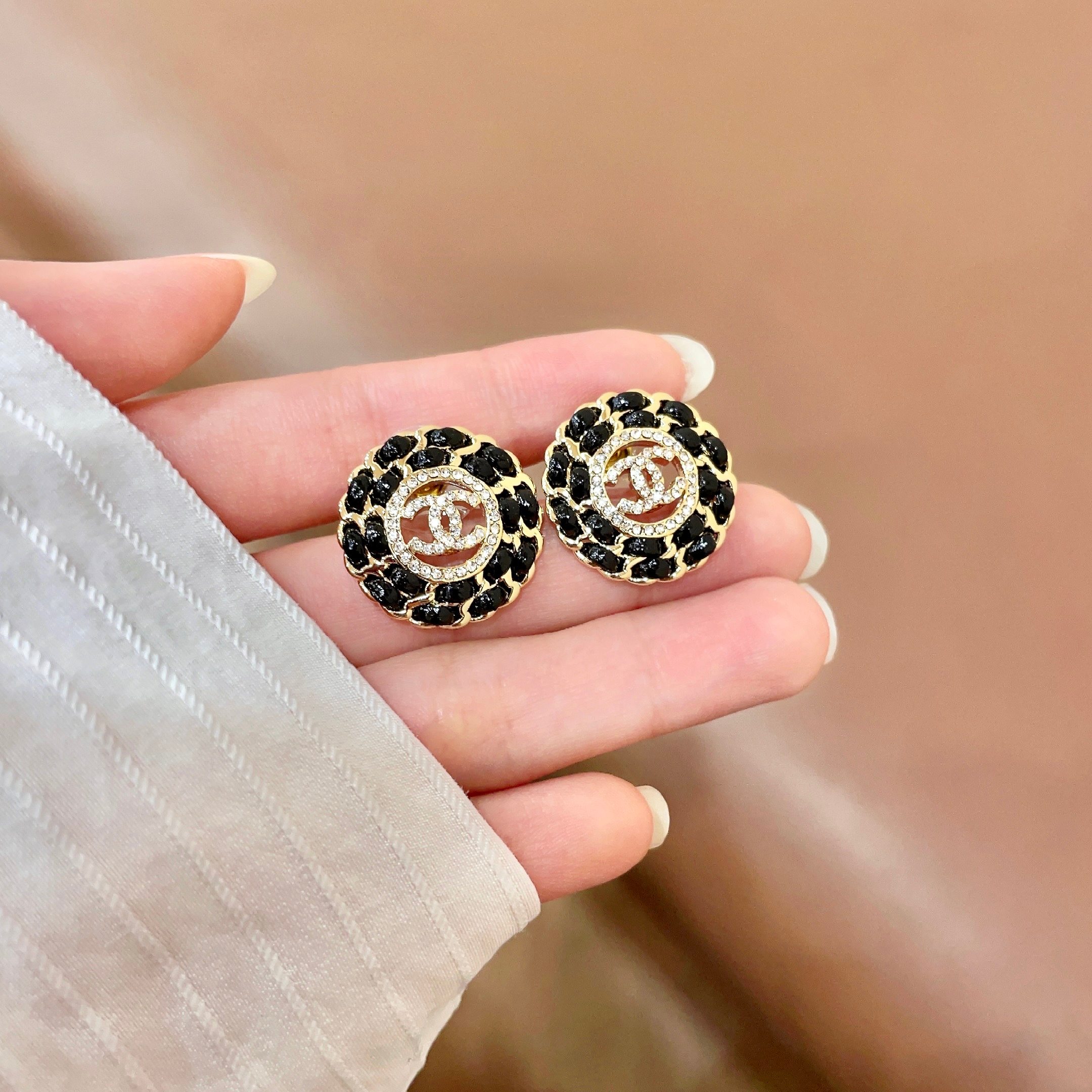 Chanel CC Logo Round Chain-Embellished Stud Earrings earrings Gold-tone metal with black resin accents and clear crystal detailing 1 8cm diameter