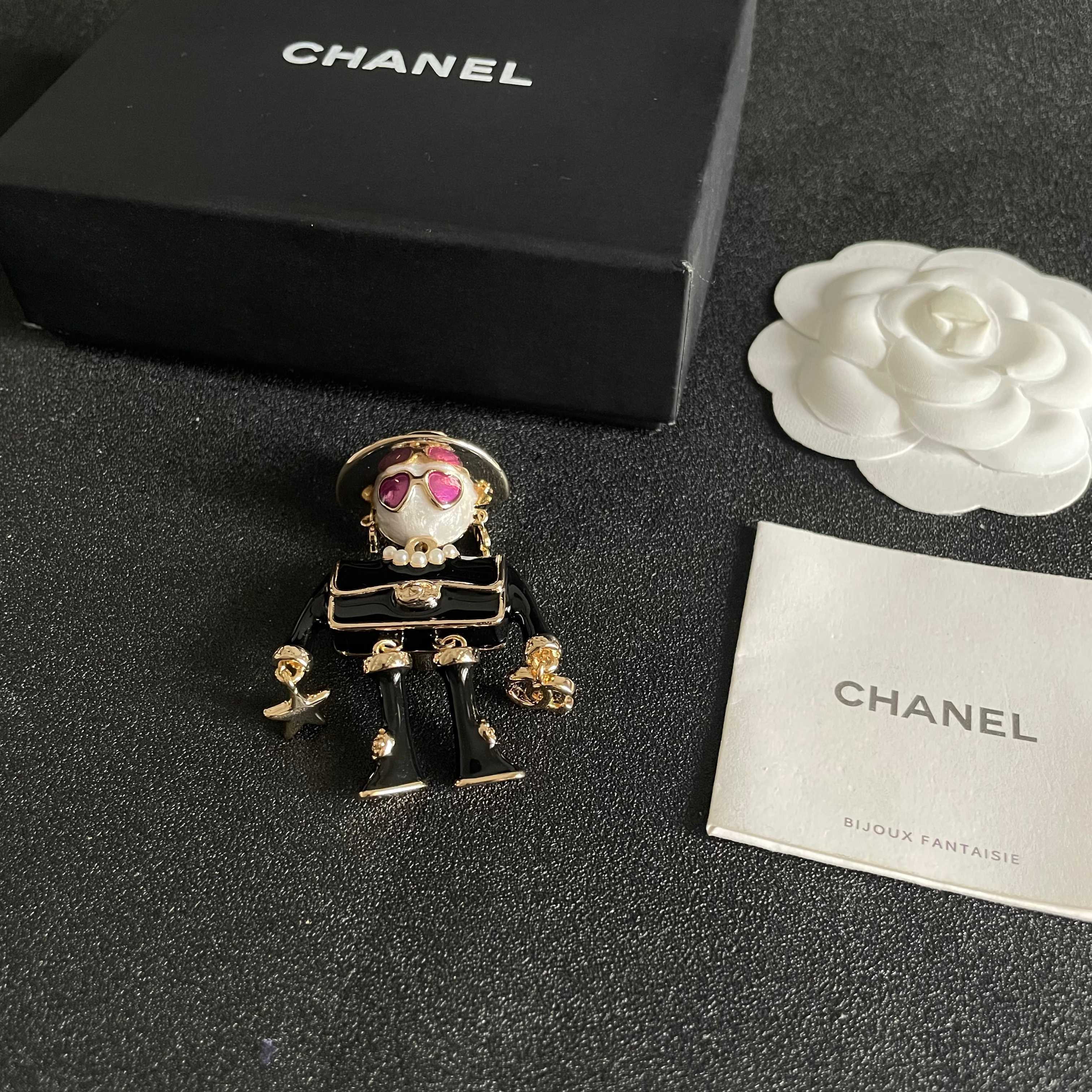 Chanel CC Logo Doll Robot Brooch brooch gold tone metal black enamel white faux pearl purple heart enamel white resin 4 5cm height