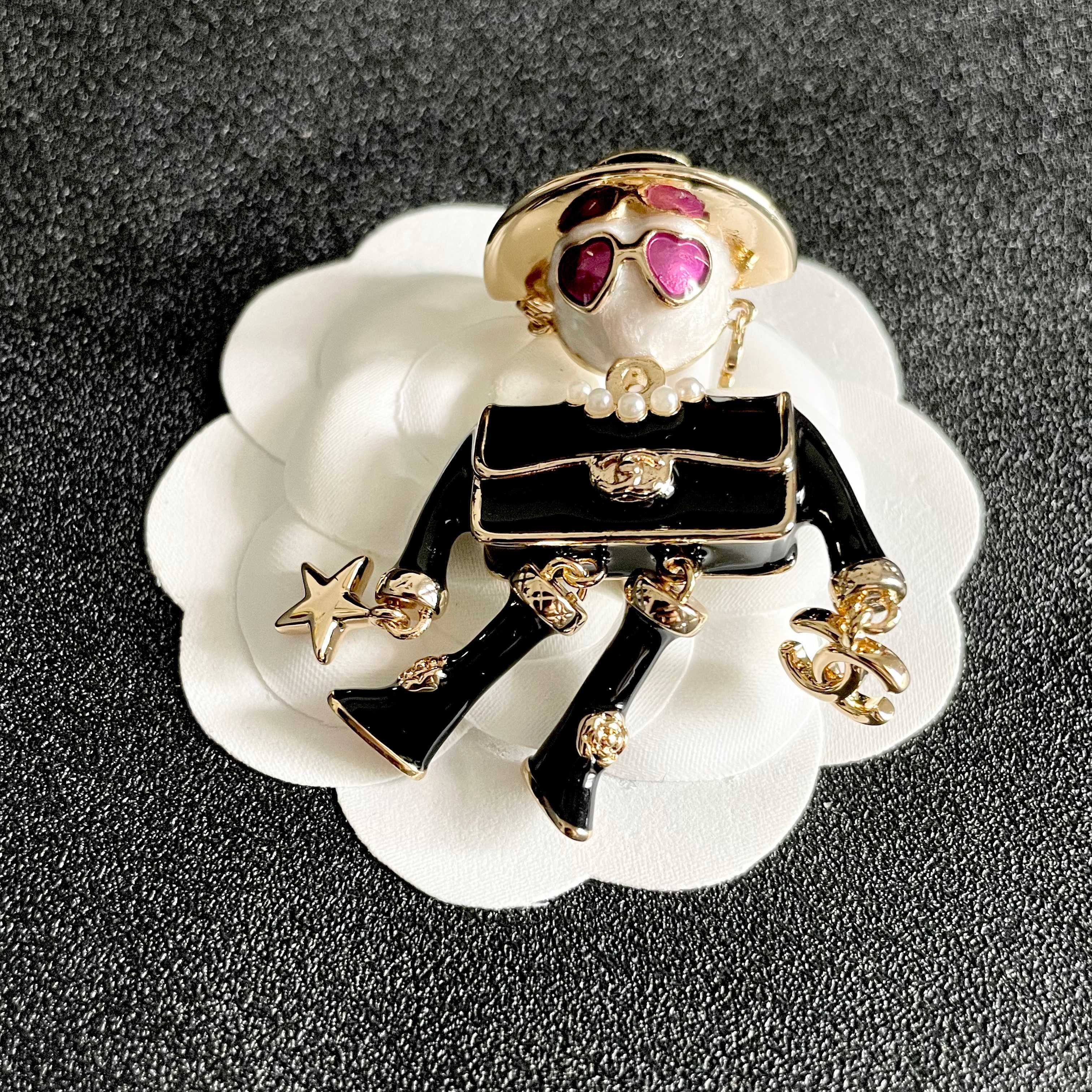 Chanel CC Logo Doll Robot Brooch brooch gold tone metal black enamel white faux pearl purple heart enamel white resin 4 5cm height