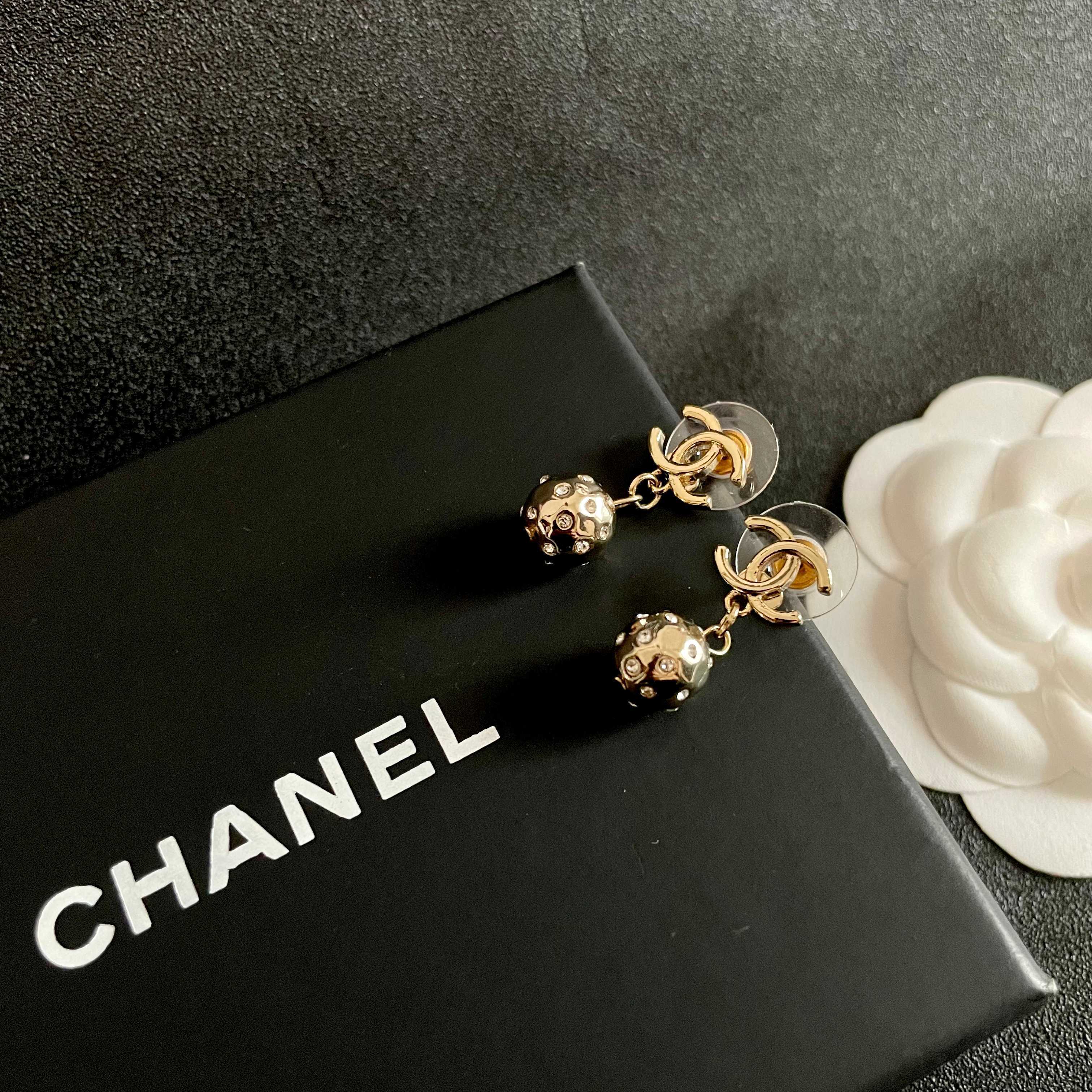 Chanel CC Logo Hammered Crystal Ball Drop Earrings earrings Light gold-tone metal with clear faceted crystal accents Approximately 2cm total drop length