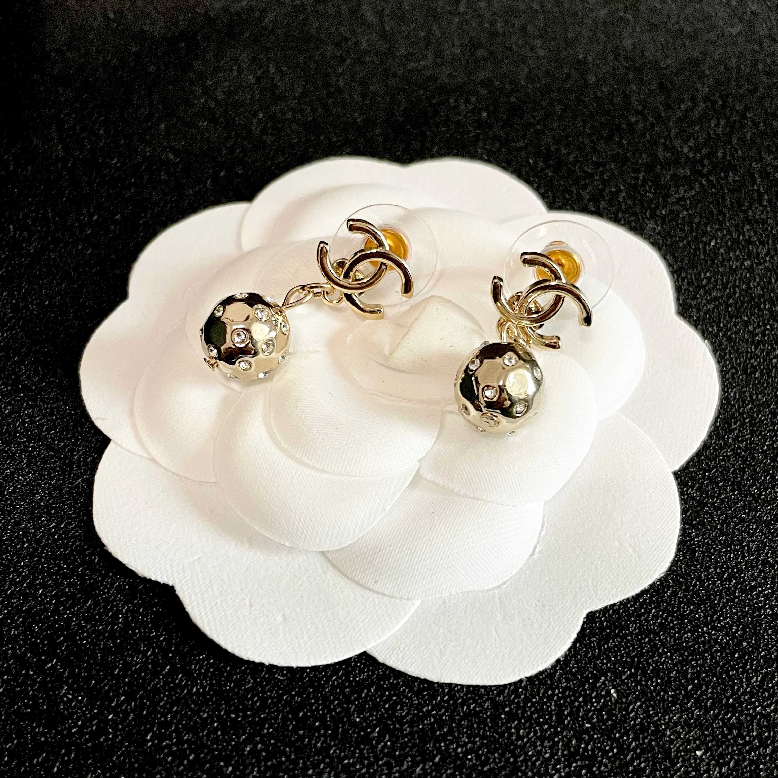 Chanel CC Logo Hammered Crystal Ball Drop Earrings earrings Light gold-tone metal with clear faceted crystal accents Approximately 2cm total drop length