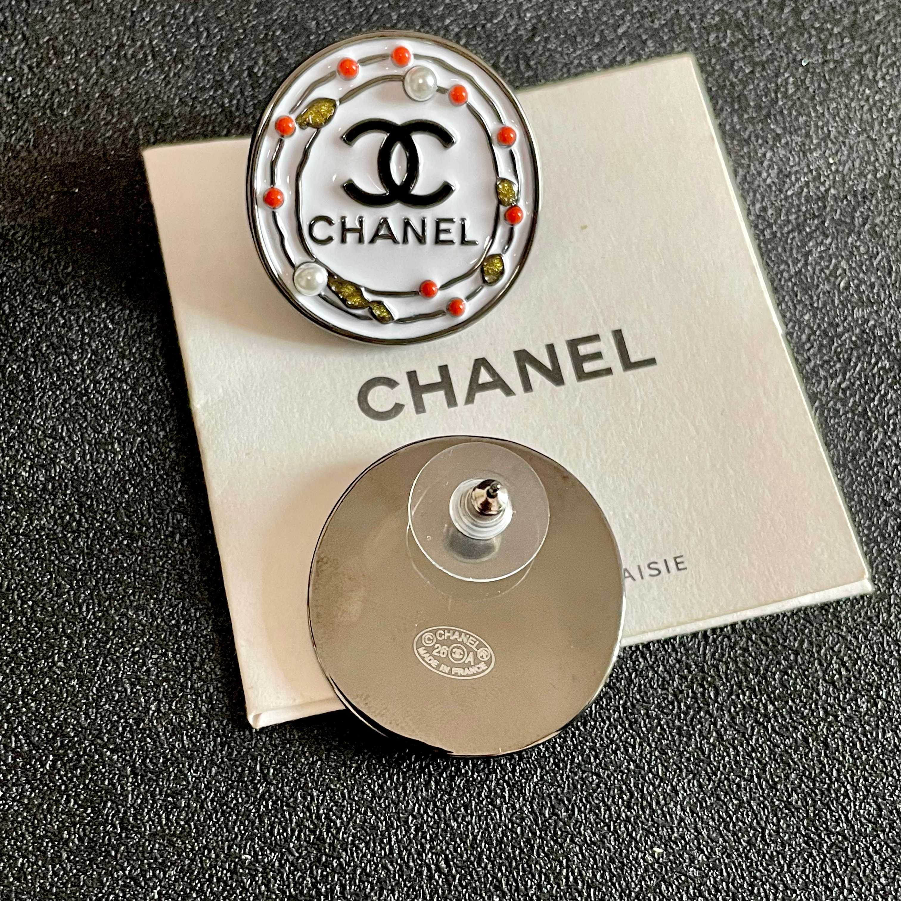 Chanel CC Logo Round Stud Earrings earrings Silver-tone metal with white enamel base black CC logo and text coral red and gold decorative accents faux pearl details 2cm diameter