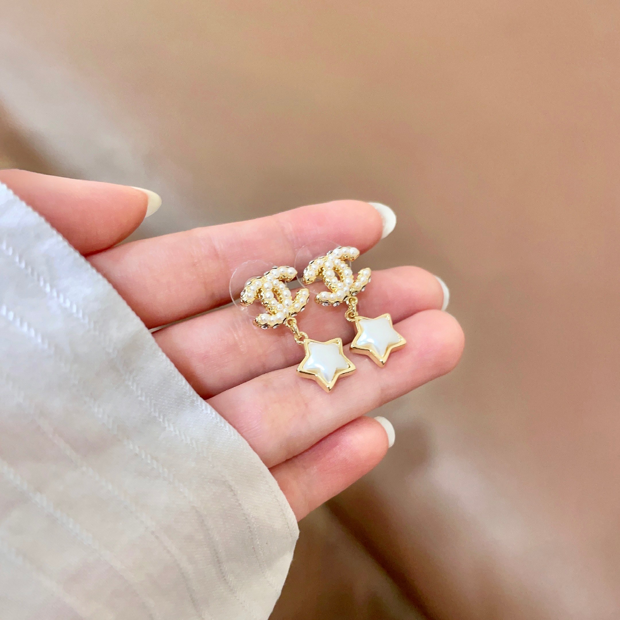 Chanel CC Star Drop Earrings earrings Gold-tone metal with cream pearl CC detailing and white mother-of-pearl star charms One Size drop length approx 2cm