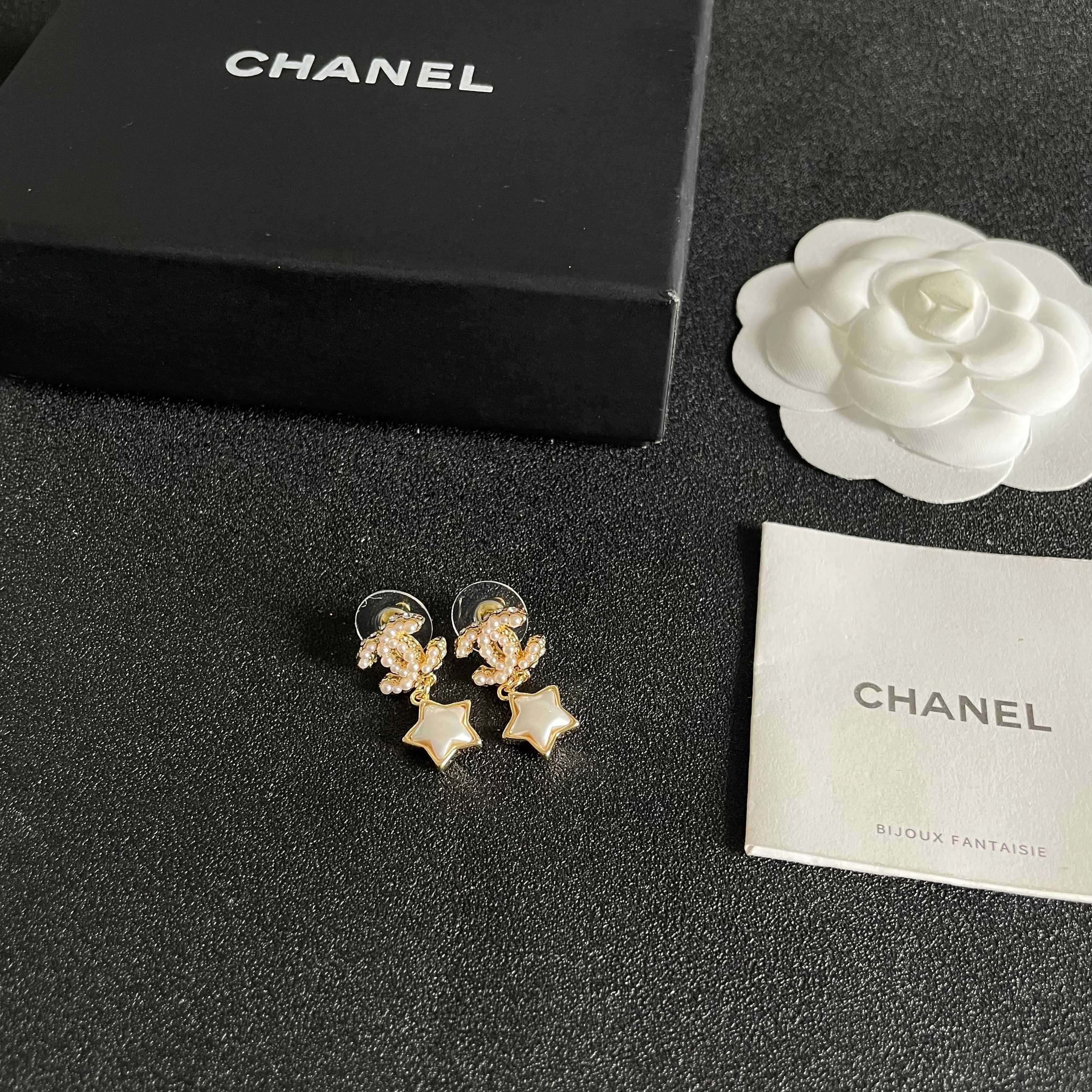 Chanel CC Star Drop Earrings earrings Gold-tone metal with cream pearl CC detailing and white mother-of-pearl star charms One Size drop length approx 2cm